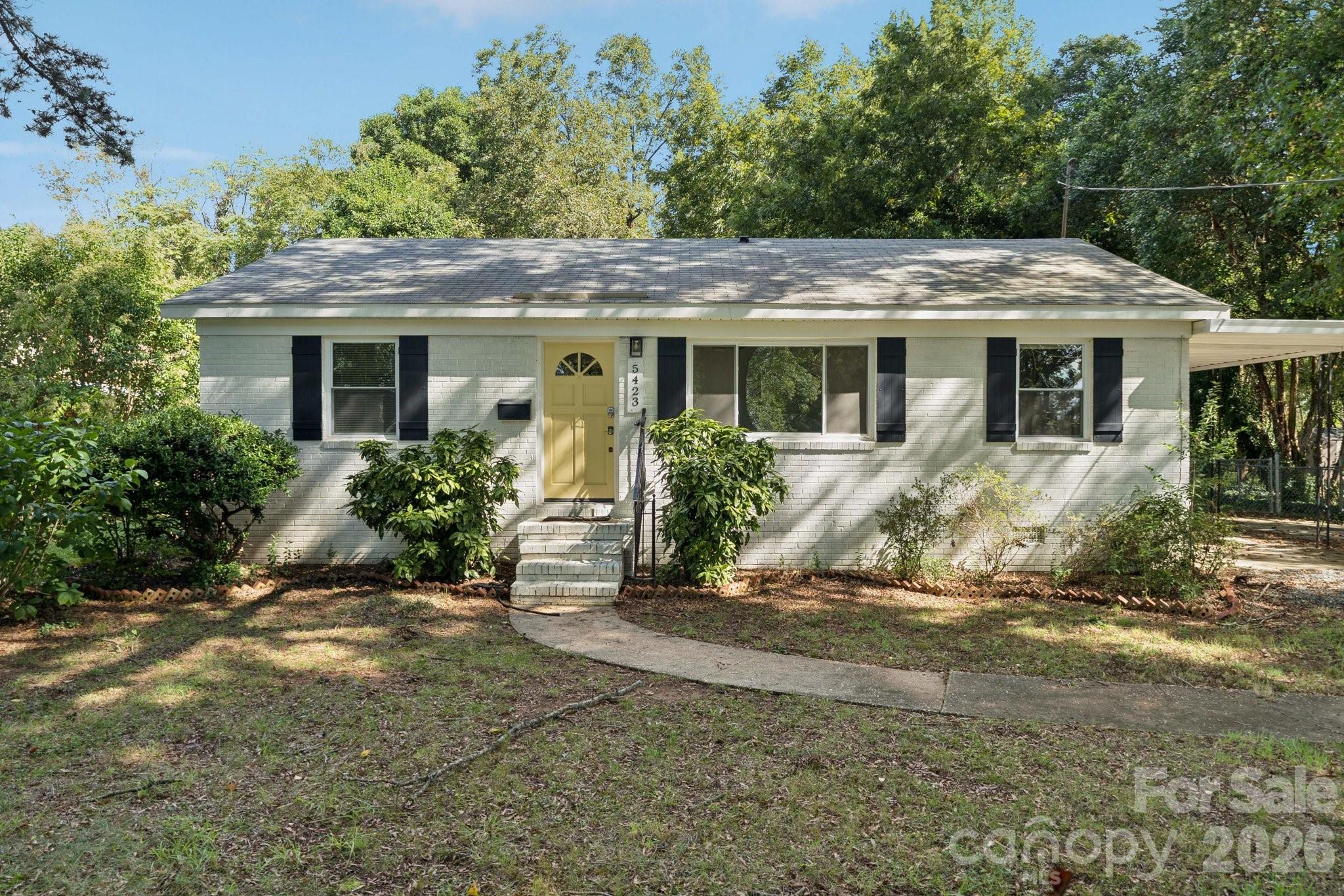 This beautiful all-brick ranch blends classic character with contemporary design. Offering 3 bedrooms and 1 full bathroom, the home has been carefully updated and ready for its new owner. The stylish kitchen features quartz countertops, crisp white shaker cabinetry, and newer stainless steel appliances - creating a perfect balance of beauty and functionality. Situated on a rare .61-acre lot with an impressive 346-foot depth, this property presents endless possibilities. Whether you dream of a private backyard retreat, expanded outdoor living, or possible opportunity of future additions, the space is here to make it happen. Ideally located between the highly sought-after Cotswold and Oakhurst neighborhoods, this home delivers exceptional convenience. Enjoy easy access to boutique shopping, popular dining spots, and everyday amenities, with Uptown Charlotte just a 7-minute drive away.