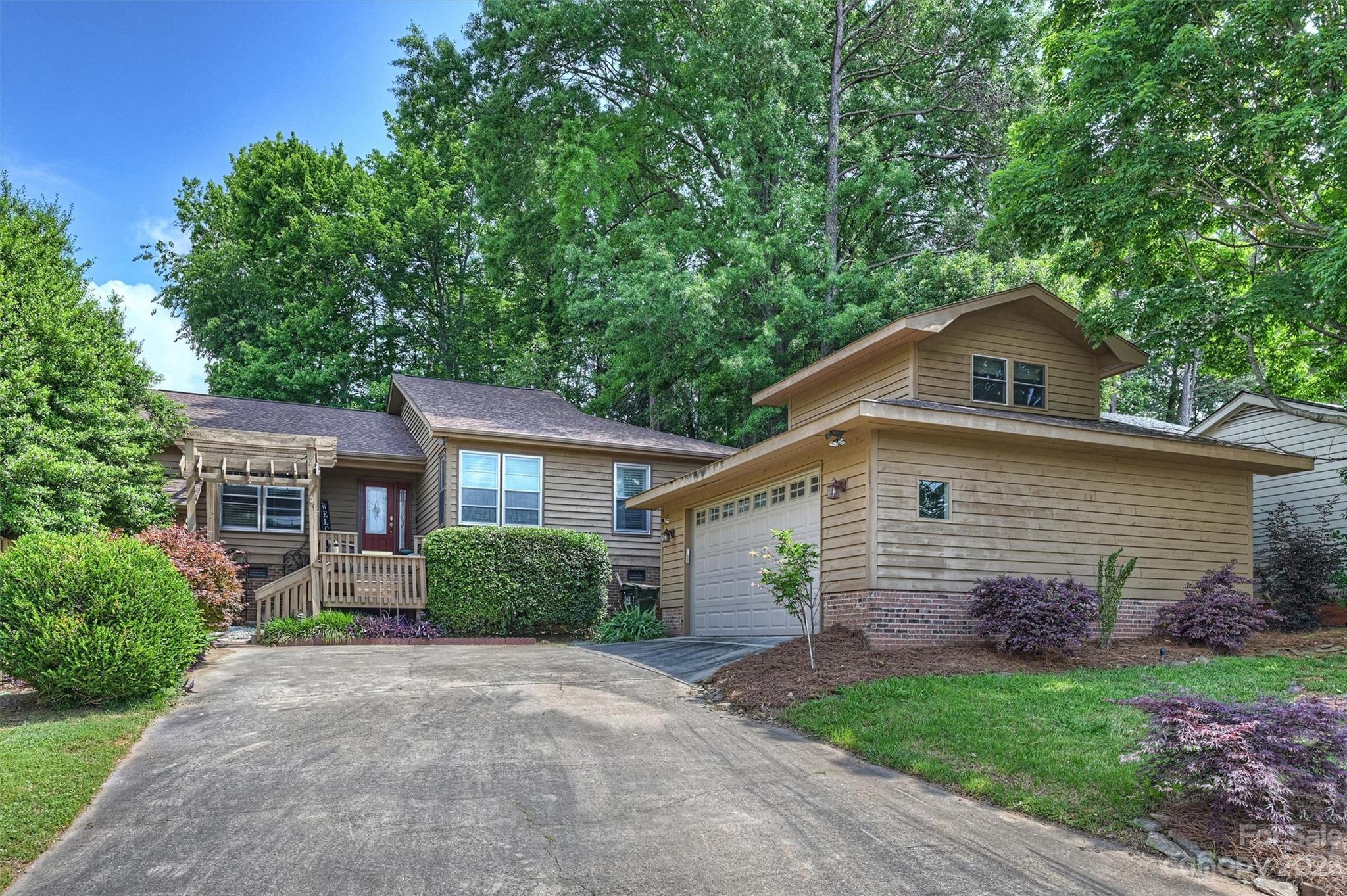 HUGE price reduction, ready for new owner. Hard to find Ranch home located in the highly desirable Rivers Hills gated golf course community. This home offers great features that include an open floorplan, updated kitchen & primary bathroom, seasonal water view from the front porch, gorgeous glass enclosed sunroom overlooking a well landscaped backyard, and massive 24X24 detached garage with 205 sqft of finished office/flex space above. Kitchen updated in 2018 with stainless appliances and quartz counter tops. Primary bath updated in 2023 with new sink vanity and custom tiled shower enclosure with dual rain head fixtures. Other great additions to this home include walk in closets, kitchen pantry, stone patio with wrap around walkway to garage, gas fireplace, backyard patio firepit, tankless water heater, exterior storage closet, and so much more. Marina and community lake amenities can be seen from the front of the home and the golf course is a short walk away.