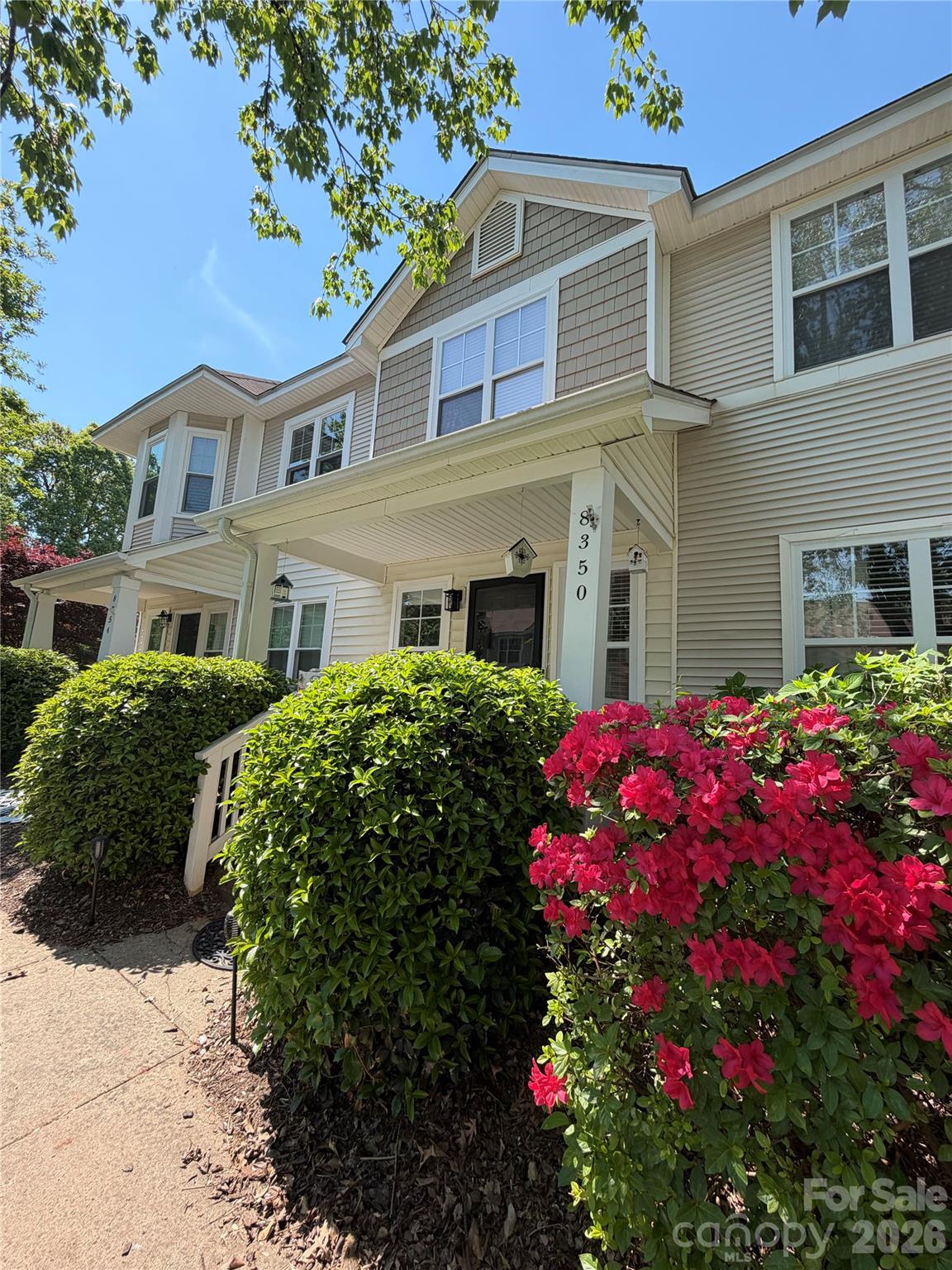 Highly sought after walkable Birkdale Village! Fun walk to shopping, dining, bars, movie theater, Starbucks, bookstore, greenway and entertainment. Located on a quiet street with a nice front porch and backyard overlooking woods and nature. Home features brand new beautiful kitchen and large Kohler sink. New stainless steel stove and dishwasher! Home is cozy with Feiss lighting, neutral finishes, hardwood floors in living and dining room, and private baths in each bedroom! Large primary BR with great walk in closet space! More updates throughout! Community offers large pool and cabanas, clubhouse, dog park, pickleball/tennis court, playground, greenway, three minutes to public golf course. Close to lake Norman, Cornelius and Charlotte Douglas airport. Home can be sold "furnished".