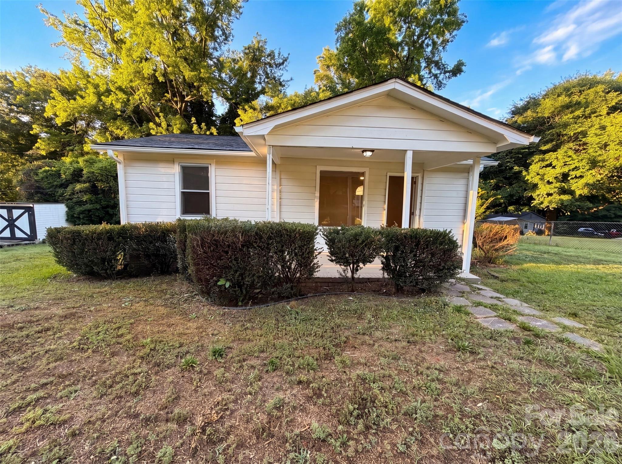 Don't miss 1413 Westside Dr, featuring comprehensive updates including a new roof and fresh exterior paint. Inside, new flooring throughout the home complements fresh interior paint. The kitchen is equipped with new stainless steel appliances. Additional property features include a carport, a deck, and a storage shed. This property blends modern updates with practical outdoor features.. Included 100-Day Home Warranty with buyer activation
