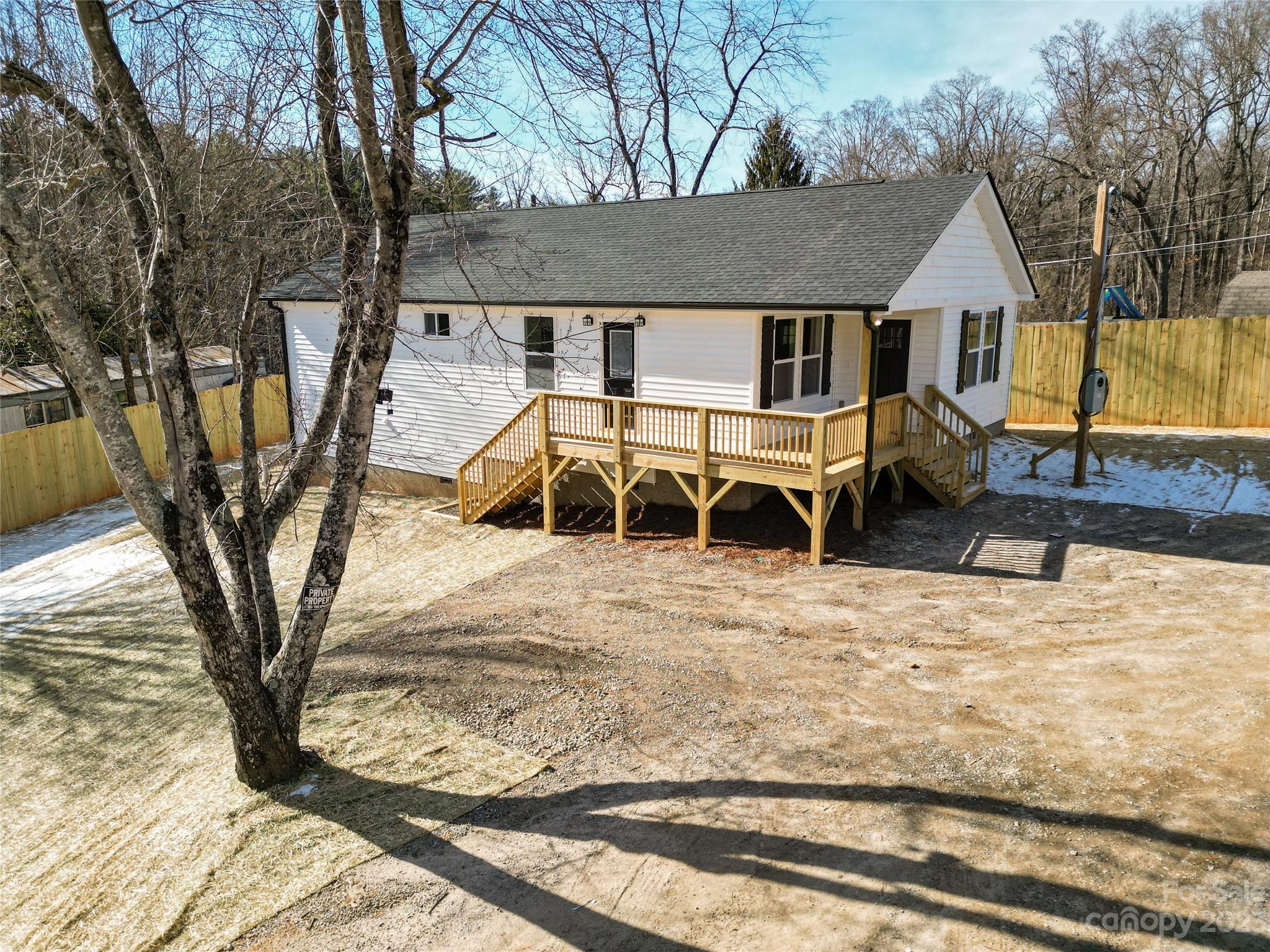 Fantastic yard right in the middle of town. Enjoy all the conveniences of restaurants, entertainment, and shopping on Tunnel Road in minutes and only 10 minutes from Downtown Asheville. Brand new construction, complete and ready for move in. Open floor plan bathed with warm natural light is perfect for entertaining. Roomy primary bedroom boasts an large walk-in closet and elegant primary bath with dual vanity and custom tile shower. Luxury vinyl plank flooring, fabulous kitchen with stainless steel appliances, granite counters, spacious all-plywood soft close cabinets, under cabinet lighting, and the perfect kitchen island. Neutral colors make decorating a breeze. Large decks are a spectacular place to enjoy that clean mountain air. Finished interior pictures are shown as an example. Finishes are consistent, but may vary slightly depending on availability. Tax value based on previous vacant land and does not represent current improvements.