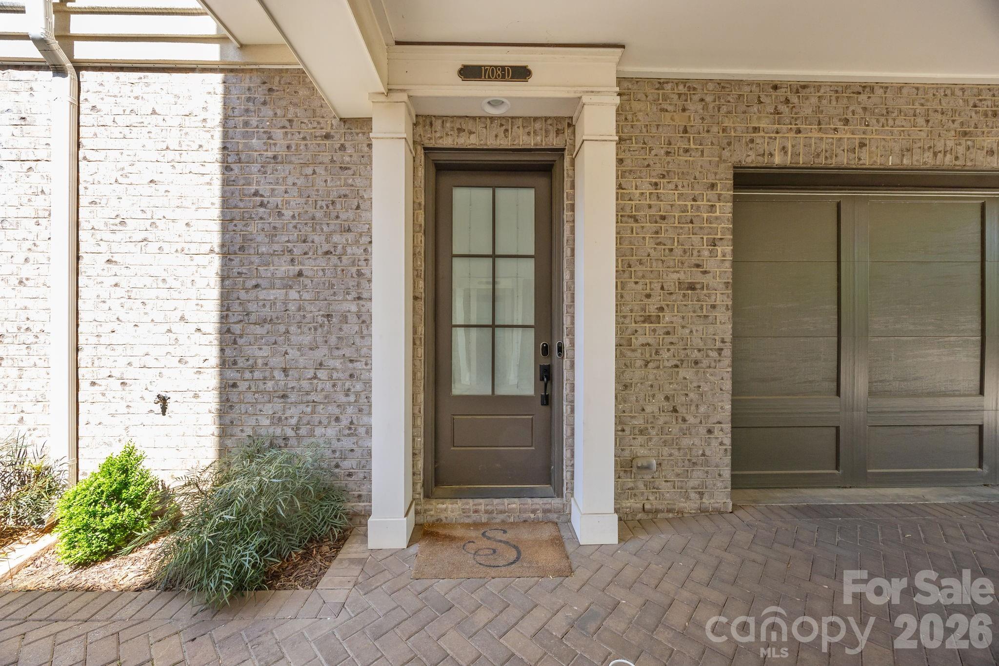 Nestled in the highly sought-after Lombardy Terrace community, this luxury condo built by Simonini, offers an exceptional blend of comfort and elegance. Thoughtfully positioned at the back of the community for added privacy and tranquility, this home showcases high-end finishes and hardwood floors throughout. The main level features an open-concept kitchen, complete with premium appliances and a spacious island—perfect for entertaining. Spacious dining and living area with gas fire place, large windows and balcony. A versatile lower-level suite provides an ideal space for guests or a second primary bedroom. Upstairs, the primary suite boasts a stunning bathroom and dual walk-in closets. A large secondary bedroom includes its own en suite bath. Upper level also has laundry room with brand new washer and dryer installed. This property also has a spacious two-car garage, which only a few in the community have. Spacious separate climate controlled storage unit located in the back of the community. Enjoy being close to Freedom Park, miles of scenic greenway trails, and the vibrant dining, shopping, and lifestyle offerings of East Boulevard, South End, and Uptown.