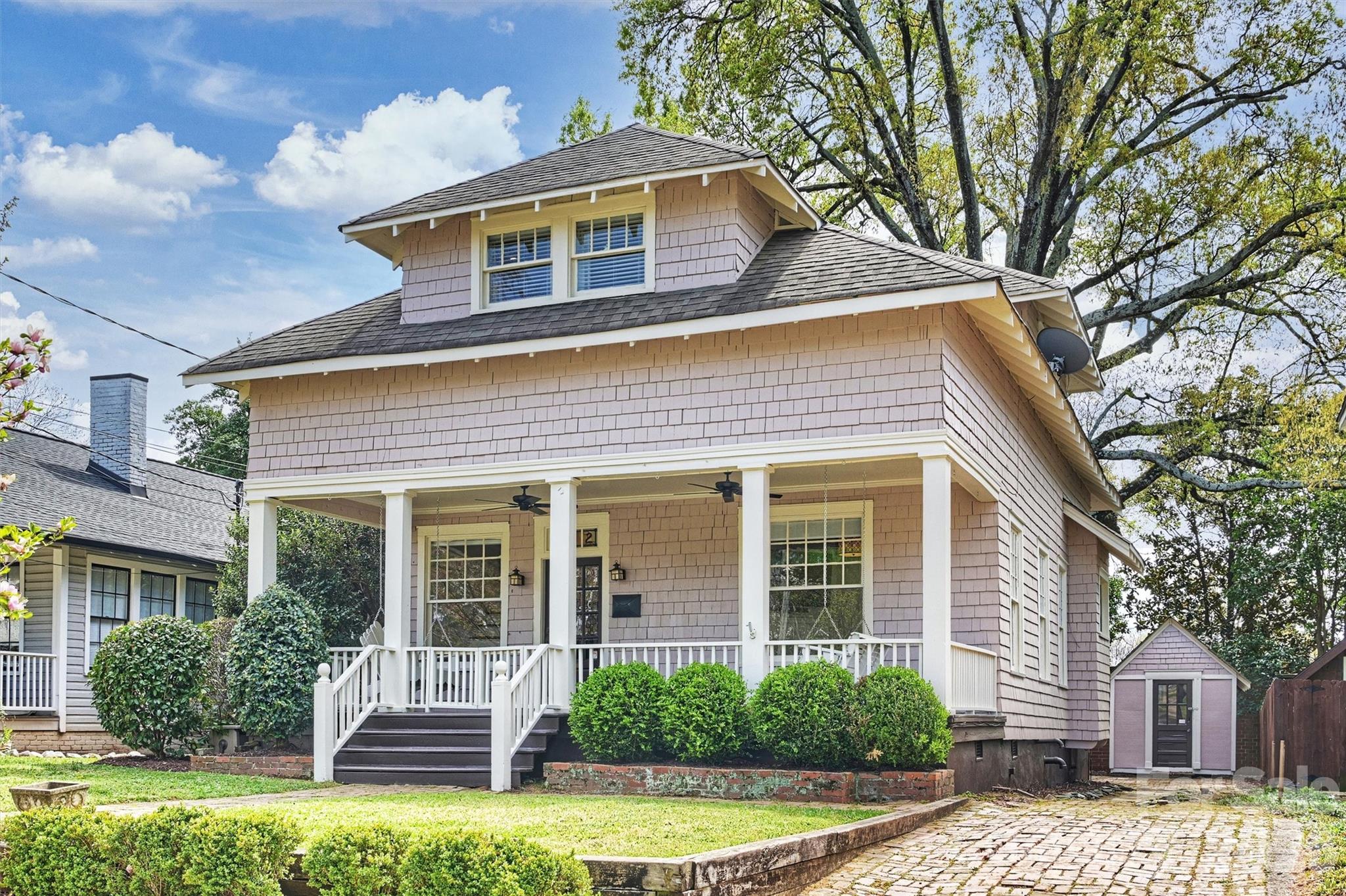 Experience urban living at its best in this charming Arts & Crafts home in the heart of Elizabeth. Home is uniquely positioned where three of Charlotte’s most sought-after neighborhoods, Uptown, Elizabeth and Plaza Midwood, converge. Enjoy unmatched connectivity with the Charlotte Lynx Gold Line (The Trolley) just blocks away or simply stroll to some of the city’s best dining, shopping, parks and entertainment. Relax on the inviting covered front porch with dual swings or entertain on the expansive rear deck. Inside, the home is rich in historic character, featuring original hardwood floors with parquet detailing, pocket doors, custom stained glass windows and doors, classic Craftsman windows, and timeless millwork throughout. Upstairs, all bedrooms and a full bath provide a private retreat, while the main level offers warm, inviting living spaces with high ceilings, original fireplaces, and timeless appeal. The kitchen and home systems blend historic charm with modern convenience, featuring a Bosch dishwasher, Frigidaire Professional series induction cooktop, newer energy-efficient HVAC units, and a tankless water heater. A rare offering that blends historic charm in a prime location.