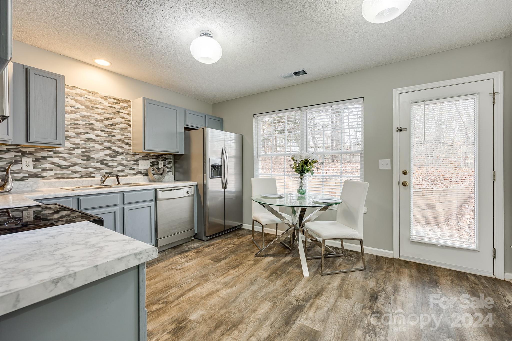 Welcome to this charming 3 bed, 2.5 bath home in Forest Oaks. This subdivision is an investor/rental-friendly neighborhood near dining and shopping. The neutral paint throughout the home allows for personalization to suit your taste. Discover an updated eat-in kitchen with stylish tile backsplash. The primary bedroom features an ensuite bathroom with a soaking tub and separate shower.  

The low-maintenance backyard, complete with a charming patio and berm with a view of the woods, offers the perfect place to relax. Additionally, the seller is providing a 1-year home warranty. The refrigerator, washer and dryer convey.  Don't miss out on this opportunity!