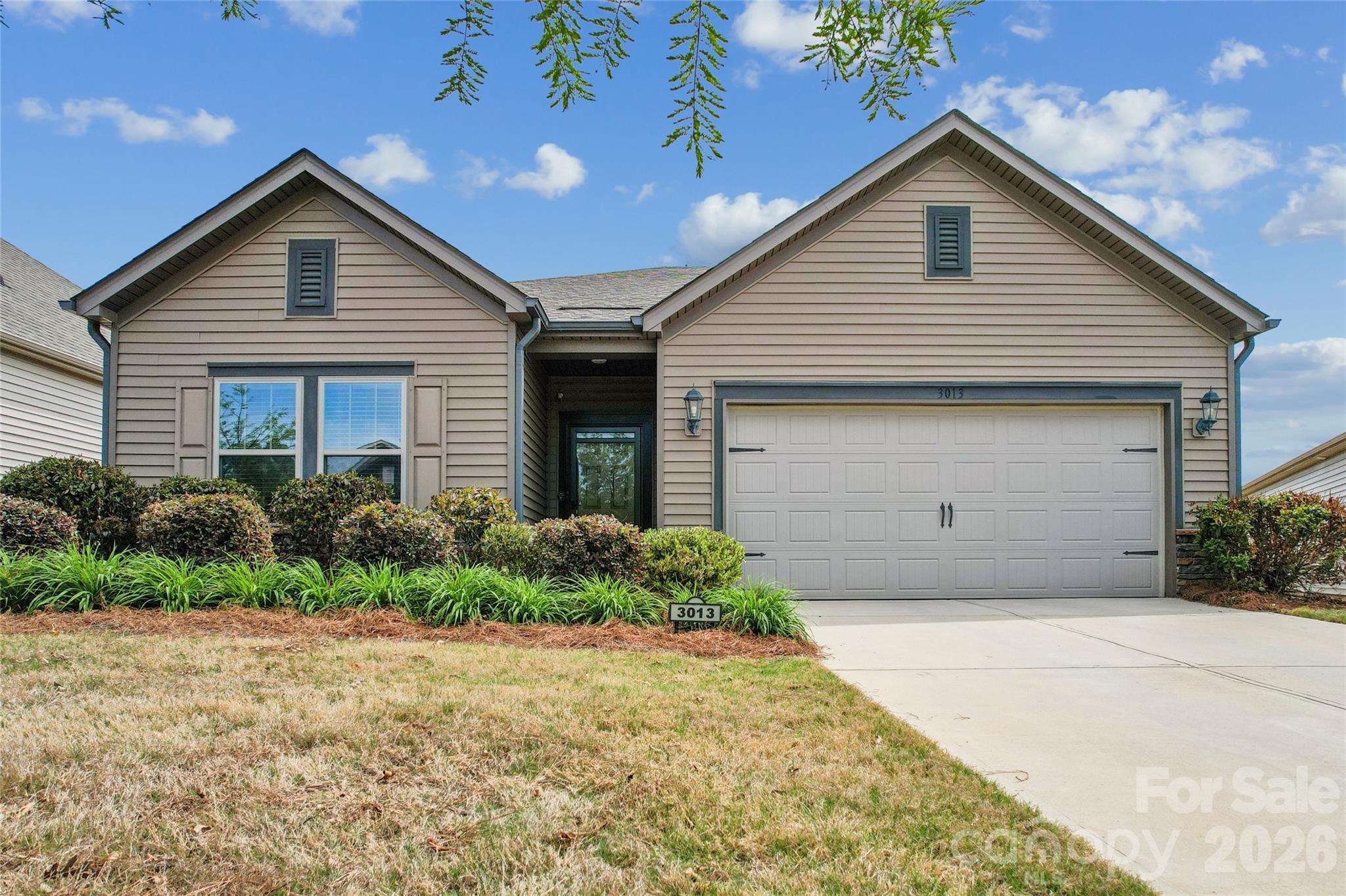 This pristine ranch home offers a seamless layout featuring a large quartz kitchen island that opens directly into the heart of the home. Luxury vinyl plank flooring spans the entire interior, complemented by tile in the bathrooms and a spacious owner's suite with a generous walk-in closet. Residents can enjoy a true low-maintenance lifestyle as the HOA includes full lawn maintenance. Significant upgrades are found throughout, including a professional polyurea coated garage floor with a lifetime warranty, a gas range, and a screened-in porch that overlooks the fully fenced backyard. Home is also pre-wired for a portable generator. Located in the desirable Larkhaven Hills community just off I-485 near downtown Mint Hill, the neighborhood features a clubhouse and community pool for resident use. This home also includes energy-efficient features designed to help reduce monthly utility costs while providing a comfortable and modern living environment.