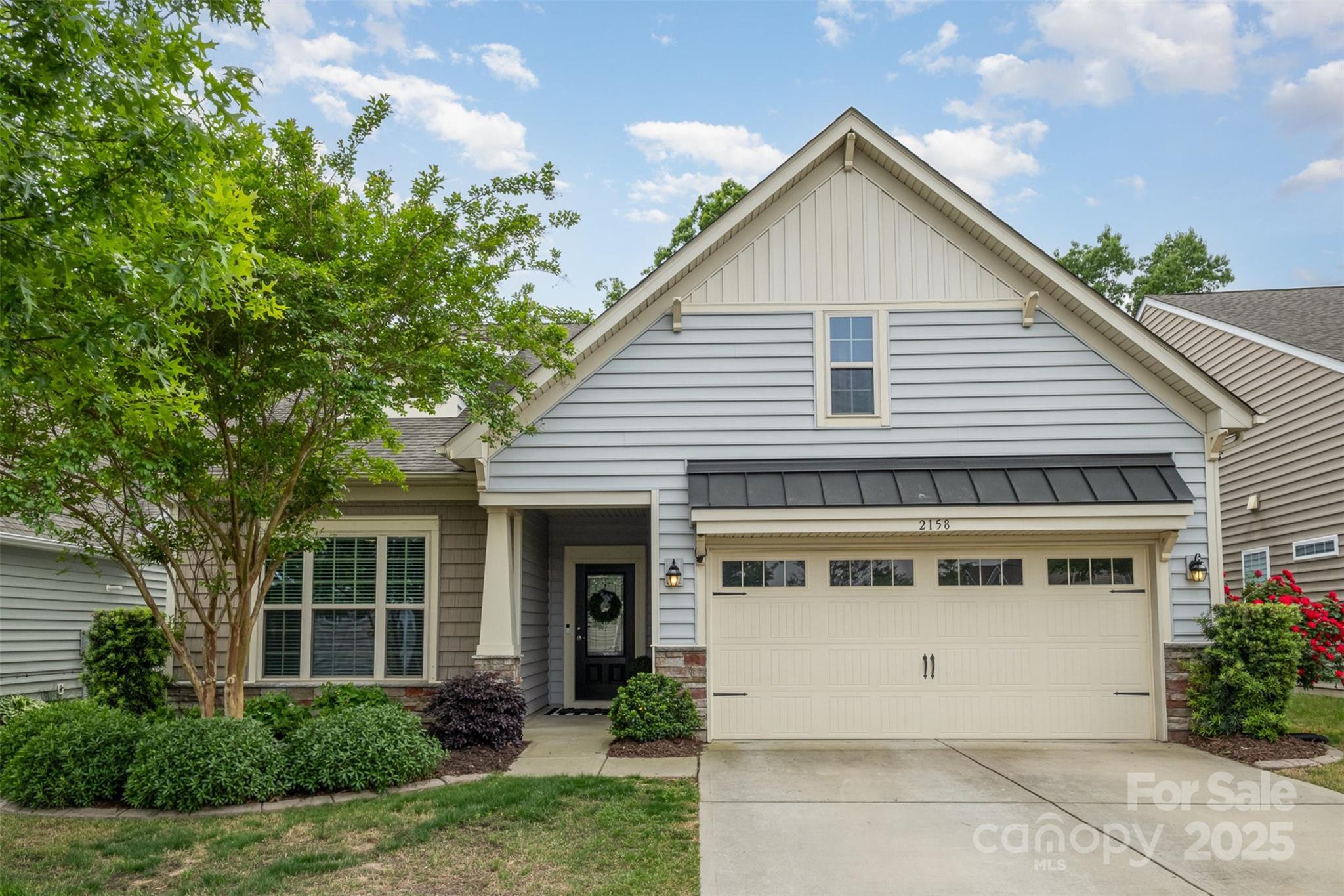 Step into charm, comfort and convenience with this beautifully updated 4-bed, 3-bath home minutes from top-rated dining, shops and the essentials of modern living. This home boasts an impressive open floor plan—perfect for entertaining or simply enjoying everyday life with ease and flow. Open kitchen shines with stainless appliances, ample cabinetry and a generous island. The spacious main-level primary suite features a cozy sitting area, large walk-in closet and a spa-inspired bath with a standalone shower. Step out from the primary onto a serene screened porch to start your day with coffee or unwind in the evening surrounded by nature. Freshly installed LVP flooring on the main level, brand-new carpet upstairs, and a neutral paint palette throughout create a move-in-ready space that feels bright, modern, and welcoming. Outside, enjoy the peaceful wooded backdrop from your private patio with a dedicated grilling area. This home is the perfect blend of style, space, and serenity.