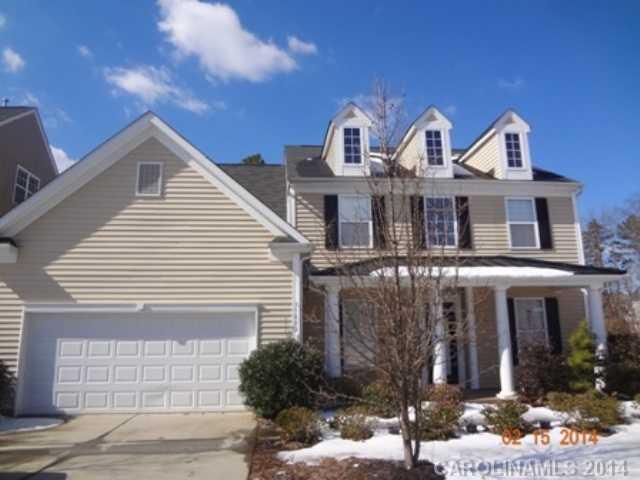 Gorgeous home with covered front porch on corner ,level lot with large back yard. Beautiful kitchen with cherry cabinets and stainless steel appliances. Two story great room with lots of windows. The breakfast area has french doors leading out to a sunroom. Master bedroom has trey ceiling, built in shelves in walk in closet. Transom windows, heavy moldings and wainscoting.
