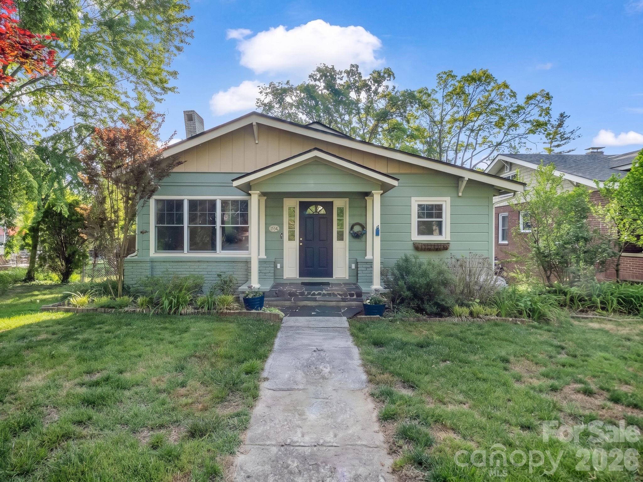 Nestled in one of Hendersonville’s most beloved established neighborhoods, Druid Hills, this charming historically registered home is ready for it's next chapter. Offering timeless character, walkability, and an unbeatable location, this is the kind of home buyers wait for.

The home is just a short walk to highly regarded schools, including Hendersonville Elementary School, making daily routines simple and convenient. Enjoy evening strolls and bike rides through the mature tree-lined neighborhood, or walk to downtown Hendersonville’s restaurants, coffee shops, library, gyms, parks, and entertainment. Healthcare facilities and medical offices are also just minutes away, making this location as practical as it is desirable.

Inside, the home blends historic charm with functional everyday living through an inviting open floor plan filled with warmth and character. Beautiful wood floors, high ceilings, detailed molding, and classic trim work create a timeless feel throughout the home. Natural light pours into the living spaces, enhancing the airy and welcoming atmosphere.

The home offers three bedrooms, including a primary suite complete with a walk-in closet and private en-suite bath. One secondary bedroom is especially bright and inspiring, featuring abundant natural light along with built-in shelving and a built-in desk—perfect for a home office, creative space, reading room, or guest retreat. The partially finished upstairs attic space provides additional flexible-use space full of charm and possibility—ideal for hobbies, storage, a playroom, studio, or cozy retreat (ceiling height just below 7 ft).

Outside, the property continues to impress with established landscaping, mature Japanese maples, a tranquil pond, and a spacious yard ideal for relaxing, entertaining, gardening, or play. More storage available in the shed and large crawlspace.

Homes with this combination of character, walkability, and prime Hendersonville location rarely become available.