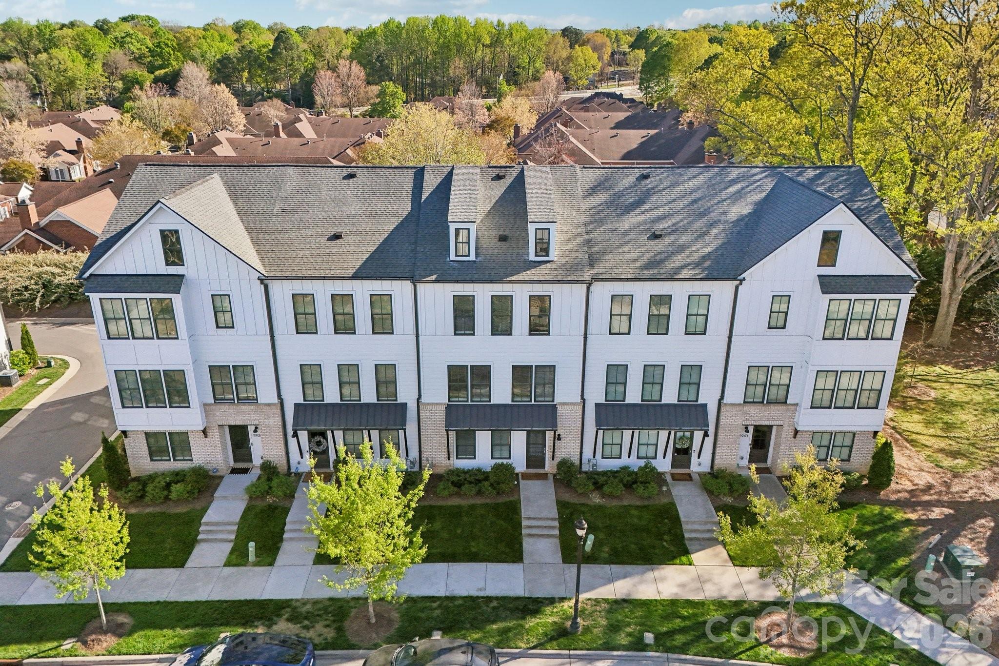 Stunning South Charlotte townhome in the heart of Ballantyne with a rooftop terrace, bonus room, and two-car garage! LENDER INCENTIVES AND SELLER CREDIT FOR 1 YEAR OF HOA FEES!

This beautifully designed home features an open-concept main living area filled with natural light and a seamless flow on each level going up to the private balcony, perfect for everyday living and entertaining. The kitchen is stunning, offering a large eat-in island, walk-in pantry, shaker-style light gray cabinetry, tile backsplash, stainless steel appliances, and polished quartz countertops.

Elegant 5-inch hardwood floors run throughout the main living spaces, complemented by tile flooring in the bathrooms and thoughtfully selected finishes throughout the home.

Upstairs, each bedroom offers its own full bathroom and walk-in closet, including a spacious primary suite with dual walk-in closets. A conveniently located laundry area adds to the home’s functional layout.

The top level features a versatile bonus room that opens to an incredible rooftop terrace, ideal for entertaining, relaxing, or enjoying treetop views and beautiful Carolina skies.

Additional highlights include a two-car garage with EV charger ready, smart home features, and included lawn maintenance for easy living.

Perfectly situated just minutes from shopping, dining, and entertainment at Ballantyne Bowl and Stonecrest, with quick access to I-485.