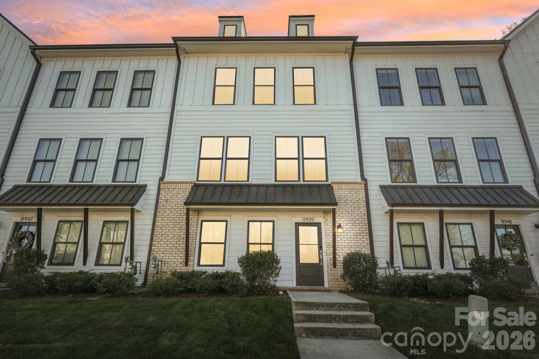 Stunning South Charlotte townhome in the heart of Ballantyne with a rooftop terrace, bonus room, and two-car garage!

This beautifully designed home features an open-concept main living area filled with natural light and a seamless flow on each level going up to the private balcony, perfect for everyday living and entertaining. The kitchen is stunning, offering a large eat-in island, walk-in pantry, shaker-style light gray cabinetry, tile backsplash, stainless steel appliances, and polished quartz countertops.

Elegant 5-inch hardwood floors run throughout the main living spaces, complemented by tile flooring in the bathrooms and thoughtfully selected finishes throughout the home.

Upstairs, each bedroom offers its own full bathroom and walk-in closet, including a spacious primary suite with dual walk-in closets. A conveniently located laundry area adds to the home’s functional layout.

The top level features a versatile bonus room that opens to an incredible rooftop terrace, ideal for entertaining, relaxing, or enjoying treetop views and beautiful Carolina skies.

Additional highlights include a two-car garage with EV charger ready, smart home features, and included lawn maintenance for easy living.

Perfectly situated just minutes from shopping, dining, and entertainment at Ballantyne Bowl and Stonecrest, with quick access to I-485.