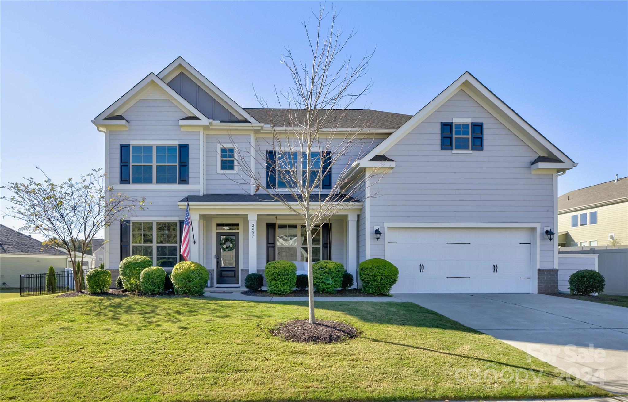 Outstanding home in desirable Carrington neighborhood in Indian Land. Upgrades abound, including heavy crown molding & custom features throughout—elegant formal dining w/ tray accent ceiling & custom wainscoting. The 2-story great room is flooded with natural highlighted by light- floor-to-ceiling stone fireplace, built-in shelving & custom shiplap accents. Guest room w/full bath on main. The gourmet kitchen will bring out the inner chef with a dual fuel range, oversized island, and crave-worthy pantry. XL primary suite has a tray ceiling, spa-like bath & huge walk-in closet. 2 additional beds, a bath, a loft, and laundry complete the upstairs. The outdoor living space is to be noticed! Fenced-in yard with custom stamped concrete patio, pergola & built-in gas grill & firepit to make the most of entertaining and relaxation. Top-rated schools and minutes to shopping & dining. This home is sure to delight!
