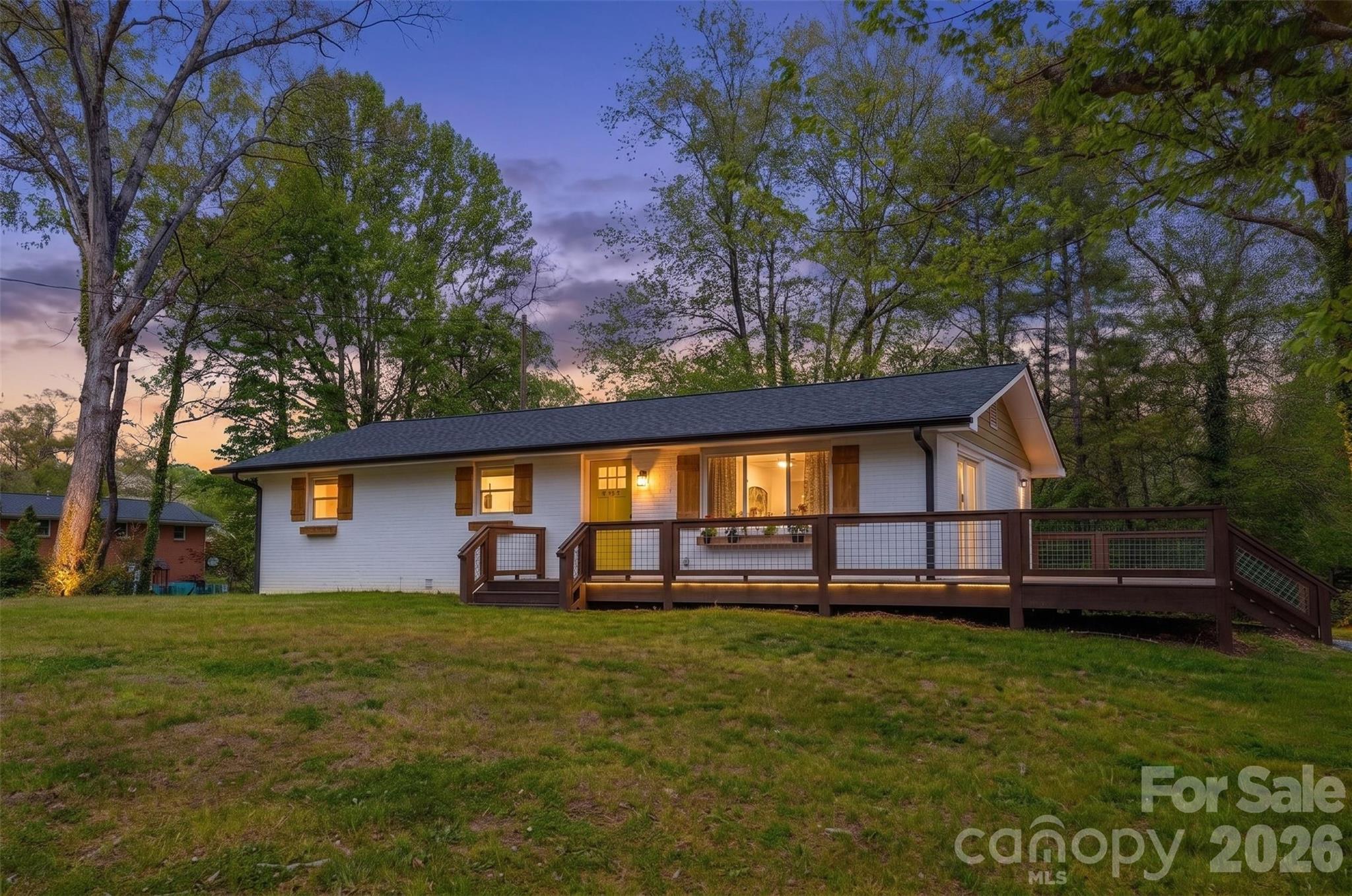 Tucked into the quiet charm of Etowah, 111 Sunset Hill Drive offers a lifestyle that blends modern upgrades with the natural beauty Western North Carolina is known for. This fully renovated 3-bedroom, 3-bathroom brick home spans 2,496 square feet and sits on a generous 0.69-acre unrestricted lot, giving you both space and flexibility. Nearly every major component has been updated—including a new roof, electrical, plumbing, HVAC, fully finished basement—providing year-round comfort and peace of mind. Inside, you’ll find stylish finishes at every turn, from waterproof flooring to new cabinetry, countertops, and stainless steel appliances, creating a home that feels both elevated and move-in ready. The main level is designed for easy living and entertaining, highlighted by a spacious primary suite with a beautifully tiled walk-in shower and a kitchen that naturally becomes the centerpiece for gathering. Downstairs, the fully finished basement has its own private entrance and dedicated mini-split systems offering incredible versatility. With ample space and layout potential, it could easily accommodate the addition of a kitchen, transforming it into a true private suite ideal for multigenerational living, long-term guests, or even a rental opportunity for supplemental income. Outdoor living is just as inviting, with a large deck perfect for hosting or unwinding, along with a covered back patio that extends your usable space year-round. The unrestricted lot gives you the freedom to garden, expand, or add a workshop—whatever fits your vision. Location is where this property truly shines. You’re just minutes from everyday conveniences like Ingles Markets and local dining spots such as Etowah Valley Golf & Resort Grill, while outdoor adventures await nearby in Pisgah National Forest and DuPont State Recreational Forest. Positioned conveniently between Hendersonville, Brevard, and Asheville, you’ll have easy access to shopping, restaurants, entertainment, and everything that makes this region so desirable. Whether you’re looking for a primary residence, a flexible multigenerational setup, or an income-producing opportunity, this home delivers the upgrades, layout, and location to support it.