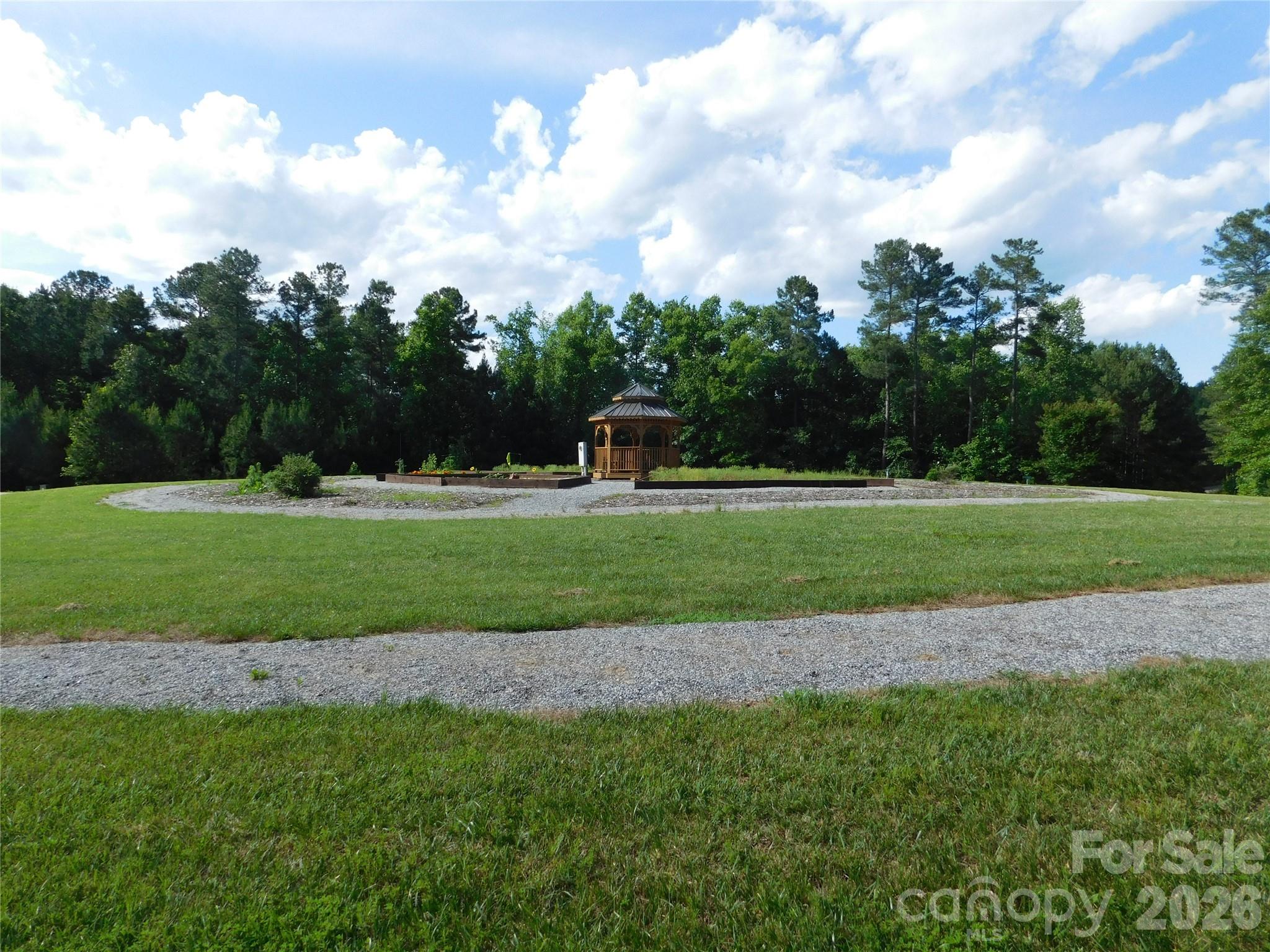 Escape to your lakeside getaway at Lake Rhodhiss Estate on this 0.61ac wooded lot. The ideal home site on this lot is a level plateau tucked away in the pine forest near the rear of the lot. Discover this growing gated community with miles of shoreline on the lake's main channel, City Water, City Sewer, underground utilities and AT&T Fiber already installed. Use one of the Local Builders or bring our Own Builder to make your dream home/vacation getaway come to life. Lake Rhodhiss Estate Community offers a Pavilion, with restrooms, a grill, a fire pit area with seating, picnic tables, and an upper deck to take in the water, mountain, and amazing sunset views.  You will enjoy the peaceful, serene rolling hills of this community and may even see some of the local wildlife. Lake Rhodhiss (Rhod-Hiss) is located 10 minutes NE from Morganton, 20 minutes west of Hickory and 40 minutes east of Asheville.