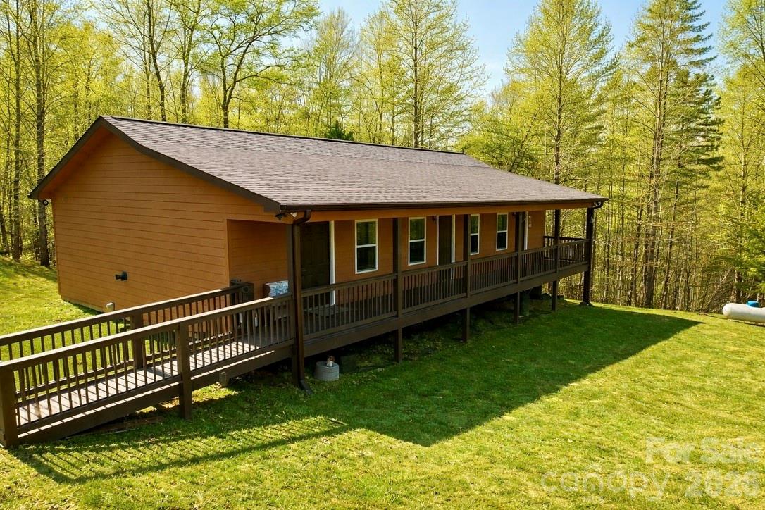 Welcome to 162 Sandstone Drive—your own peaceful retreat in Union Mills, NC.

Set on 3.18 acres within the gated community of Hearthstone Ridge, this inviting single-level home offers a setting that feels private, quiet, and easy to settle into.

The full-length covered front porch is perfect for slow mornings with coffee, quiet afternoons, and evenings spent unwinding as you take in the surrounding scenery. It’s a space that naturally draws you in and invites you to stay awhile.

Inside, the home opens to a comfortable layout designed for both everyday living as well as entertaining. The spacious living area connects seamlessly to the kitchen, where you’ll find ample cabinetry and generous counter space.

The primary suite offers a relaxing place to recharge, complete with a large closet and private bath. The secondary bedroom also features its own private bath, creating a welcoming and comfortable setup for guests.

Outside, the property truly shines. With a generous yard and wooded surroundings, there’s plenty of space to enjoy the outdoors, explore, or simply take in the peaceful setting.

This is a home that truly feels comfortable, welcoming, and ready to be enjoyed from the moment you arrive.