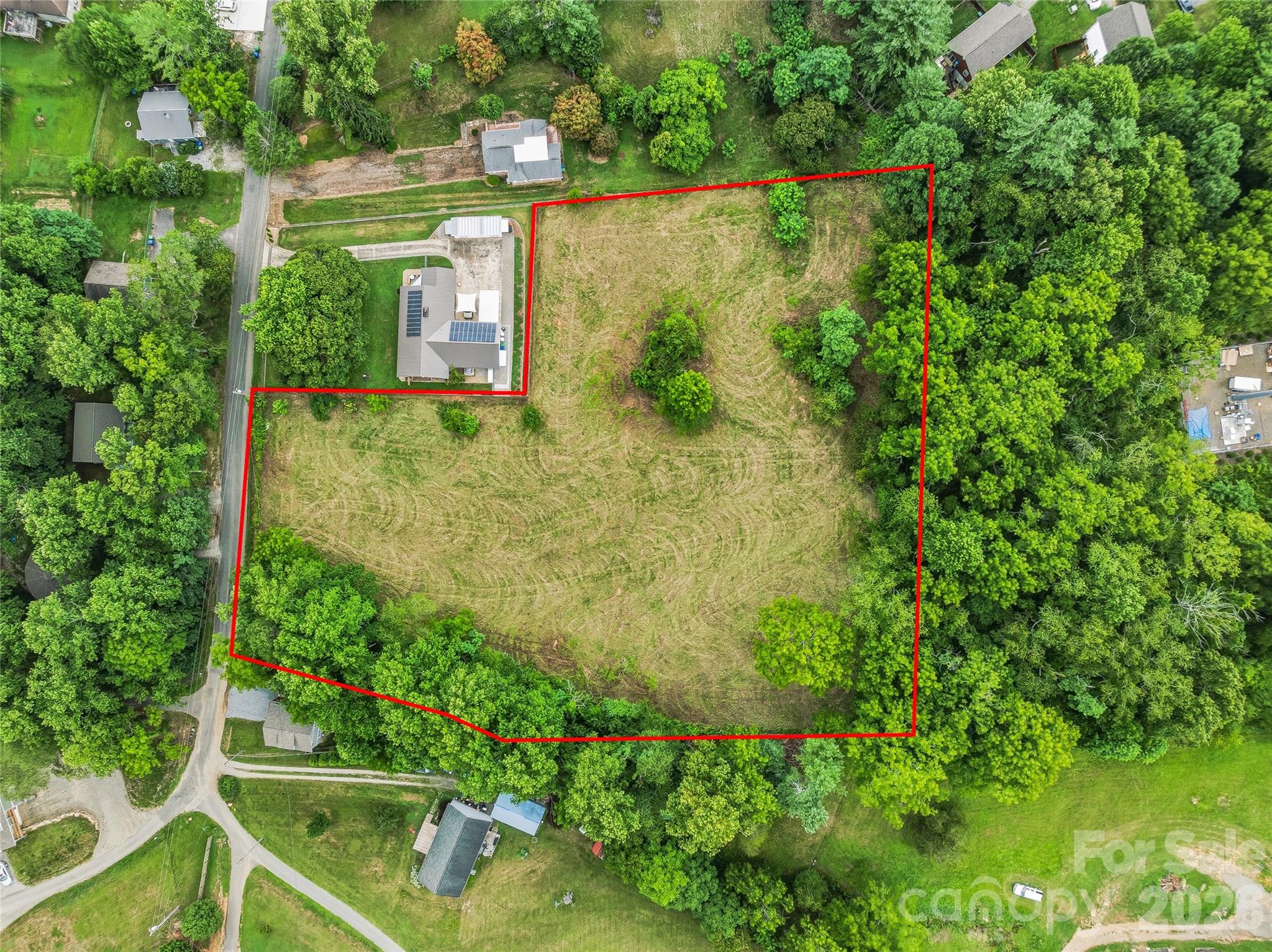 Exceptional residential development opportunity in West Asheville, just outside of Asheville City limits! This 2.63 acre level and cleared parcel is located on Daniel Road, offering approximately 172 feet of state road frontage and is zoned R-3 (Residential Multi-Family High Density). This versatile zoning allows for a variety of residential uses, including single-family homes, duplexes, townhomes, and other multi-family residential development (subject to local zoning regulations, permitting, and approvals). With its gentle topography and cleared landscape, as well as access to City water & sewer, this property is well positioned for an easier building process and higher density development. Conveniently located just 2 miles from I-40, approximately 5 miles from I-26, and less than 3 miles from US-19/23 (Patton Avenue), the property offers excellent access to downtown Asheville, shopping, dining, schools, and regional transportation while maintaining the quieter neighborhood feel and flexibility of a spacious homesite. Whether you're a builder, developer, or investor looking for your next project, this property presents an outstanding opportunity in one of Asheville's growing areas. Also listed at MLS# 4404253.