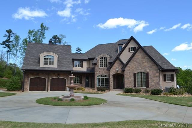 This custom built home offers lakefront living at its best! Grand entrance introduces the lake at first entrance. Great entertaining home with open floor plan. Granite chef's kitchen, floor to ceiling stone fireplace in GR and large DR. Master suite and spa like bath with heated floors on main. Inground salt water pool, hot tub, large dock with sun deck, screen porch, balcony. Property is completed fenced and gated. Detached garage offers great additional storage. Tons of architectural details.