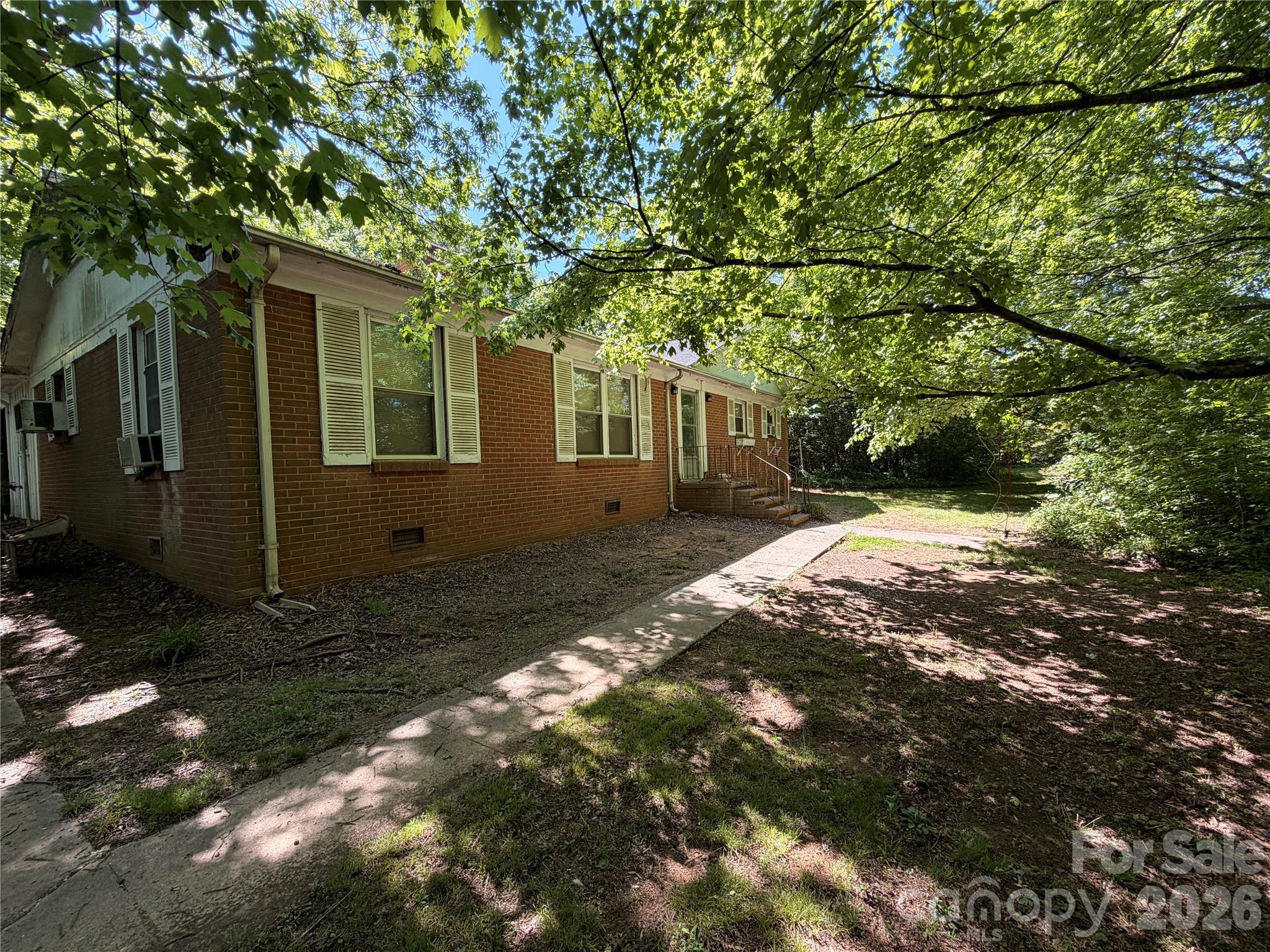 This rare opportunity offers a scenic lot with peaceful pond views, perfect for those looking to build, invest, or develop. The property sits in a quiet, established neighborhood with no HOA, and combines a tucked-away feel with unbeatable convenience—just a short drive to Uptown and close to several parks and everyday amenities. With strong growth happening in the area, this corner-lot presents unique potential for investors, including the option to tear down and subdivide for new development. Whether you’re envisioning a private retreat or your next project, this property is full of possibilities in a rapidly developing location.