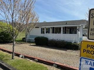 Charming, older maintained 2 Bedroom, 1 and half bath Park Model.  Needs some TLC , Located in Summer Place a Deed restricted pride of ownership 55 + community. 25 Summer Place is the first home as you enter the community. Lot has trees and lawn area in back perfect for garden area.  Behind the home is a scenic pasture which ensures privacy Porch has year round mountain and pasture views. Paved roads for walking and bike riding. Easy access to I-40 and minutes to Waynesville and Maggie Valley  55 and up deed restriction, one pet under 40lbs, Long term rentals allowed, no STR."Sold as is" Refrigerator needs to be replaced