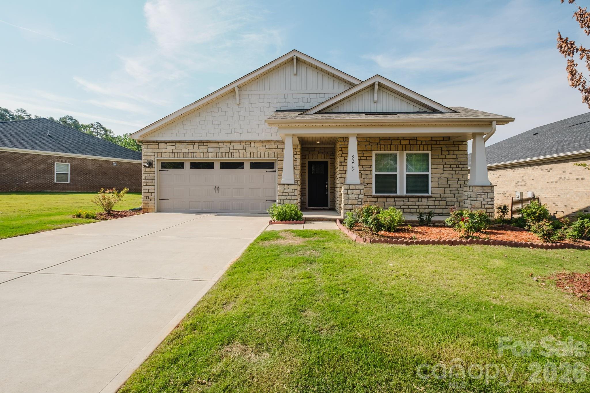 Looks like it was just built. Thoughtfully designed one-level ranch in the desirable Heron Creek community of Mint Hill. This light-filled home features an open-concept layout with a spacious great room and fireplace, a beautifully appointed kitchen with generous counter space, and a flexible bonus room or office that easily adapts to your lifestyle. The primary suite is thoughtfully positioned and includes a well-designed ensuite bath, creating an easy and functional flow throughout the home. Large windows fill the living spaces with natural light, while elevated finishes and intentional design details create a warm and inviting atmosphere. A private screened porch extends the living space outdoors, providing the perfect setting for morning coffee, evening relaxation, or entertaining guests. Enjoy the extra-large flat lot. The oversized two-car garage offers ample room for vehicles, storage, and hobbies. Situated on an extra-wide, level homesite, the expansive yard provides exceptional outdoor space for recreation and gardening. Conveniently located near shopping, dining, and everyday amenities, this meticulously maintained home.