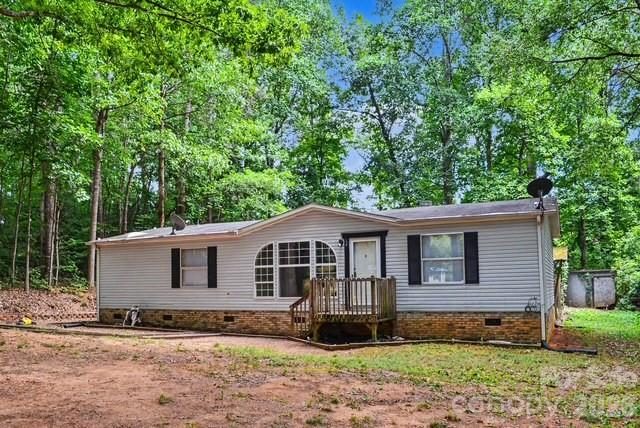 Welcome home to this beautifully remodeled 3-bedroom, 2-bath home tucked away on a quiet dead-end dirt road, offering the perfect blend of privacy and peaceful country living. Inside, you’ll find a split bedroom plan, new flooring throughout and fresh paint, a gas log fireplace, eat in kitchen with refrigerator, electric range and dishwasher creating  a warm and inviting atmosphere. The spacious layout provides comfortable living areas, well-appointed bedrooms, and two full bathrooms. Enjoy the tranquility of a low-traffic location with plenty of room to relax, entertain, or simply take in the surrounding natural beauty. Whether you’re looking for a peaceful retreat or a place to call home, this move-in-ready property is one you won’t want to miss.