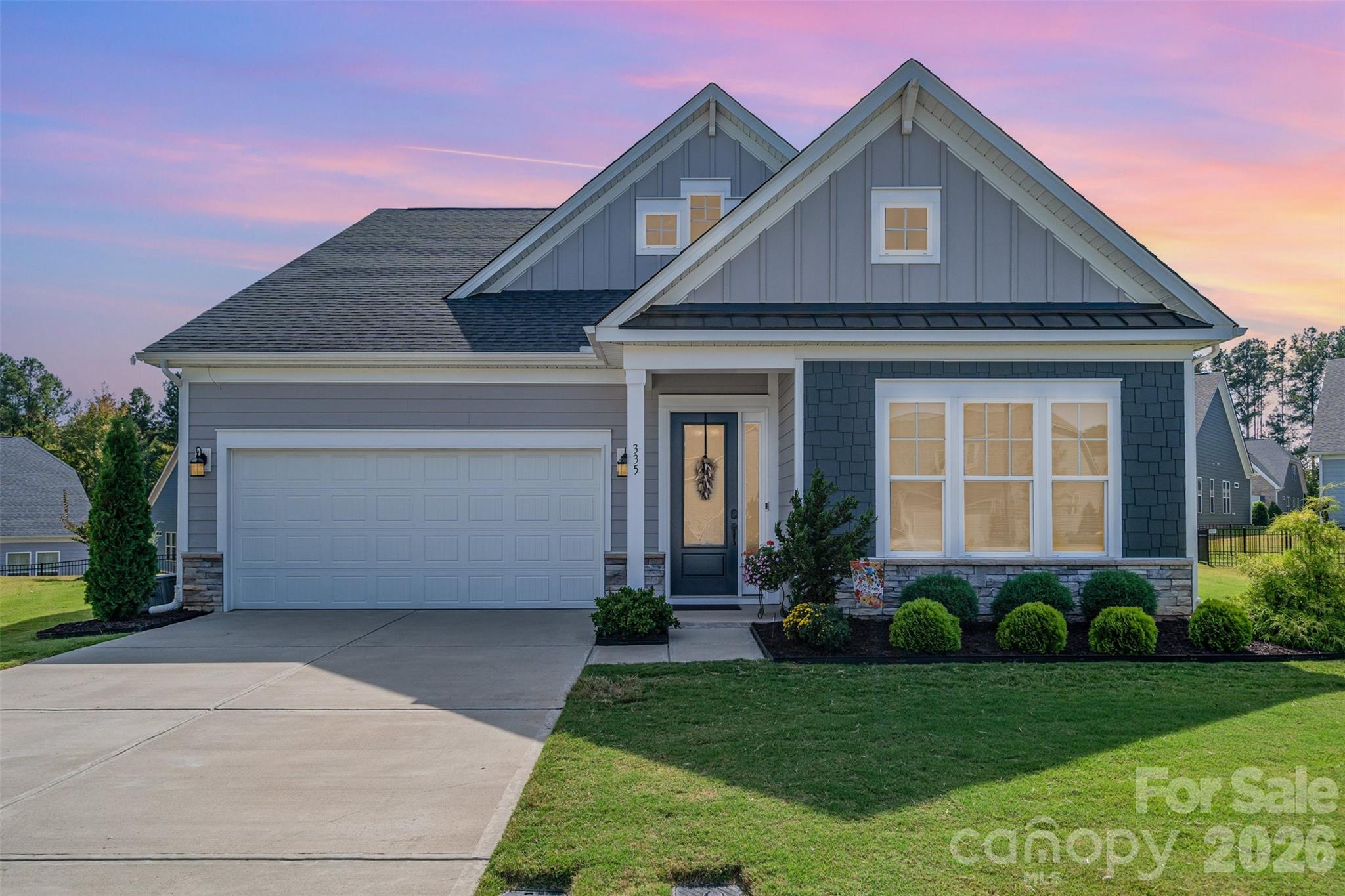 Welcome to 335 Brambling Court in Pinnacle at Wesley Chapel, a vibrant 55+ community where modern living meets comfort and convenience. Built in 2021 and set on a quiet cul-de-sac, this beautifully upgraded home offers 3 bedrooms, 3.5 baths, a large office, and exceptional design tailored for everyday ease and entertaining. The main level features engineered hardwoods throughout, an open layout with a spacious primary suite, complete with a roll-in shower, Closets by Design custom shelving and cabinetry, and framed vanity mirrors for a touch of elegance. A generous office provides flexible space for work or hobbies, while a built-in buffet with abundant storage adds both functionality and a custom feel to the dining area. Plantation shutters and room-darkening Duet shades are installed throughout, providing both style and function. In the kitchen, upgrades include a Bosch dishwasher, super-quiet disposal, a high-capacity hood, and stylish lighting and ceiling fans that enhance the home’s livability. Upstairs offers a true second living space, perfect for guests. It includes a large family room, bedroom, full bath with frameless shower enclosure, and two walkout storage rooms for added convenience.

The outdoor spaces have been thoughtfully designed for enjoyment and low-maintenance living. A screened back porch with an epoxy-coated floor opens onto a large paver patio, perfect for entertaining. Professional landscaping features rock gardens, landscape beds on all sides, and cypress trees and crape myrtles in the backyard. Additional highlights include an irrigation system, epoxy-coated garage floor, overhead garage shelving, keyless smart entry lock, and custom shelving in the pantry and under-stair closet. Every detail has been carefully considered to maximize style, comfort, and functionality.

Residents of Pinnacle at Wesley Chapel enjoy a clubhouse with gathering space, an exercise room with equipment, and a bocce court, adding to the appeal of this move-in ready home. 335 Brambling Court represents a rare opportunity to own an upgraded, thoughtfully designed home in one of the area’s most desirable active-adult neighborhoods.