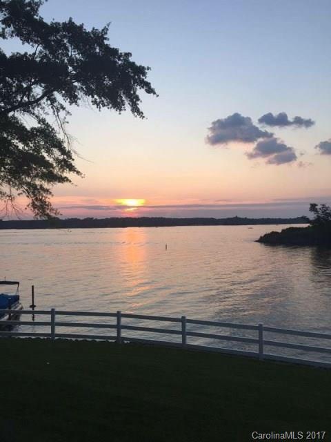 Beautiful ranch home on Lake Wylie in Tega Cay. This home offers 3 BRs each with water views and private baths. Also, a 3 gar garage in basement with service door, 2 docks and plenty of room for parking. Don't miss out on this one! Make it yours and enjoy the beautiful sunsets and panoramic views!!!!