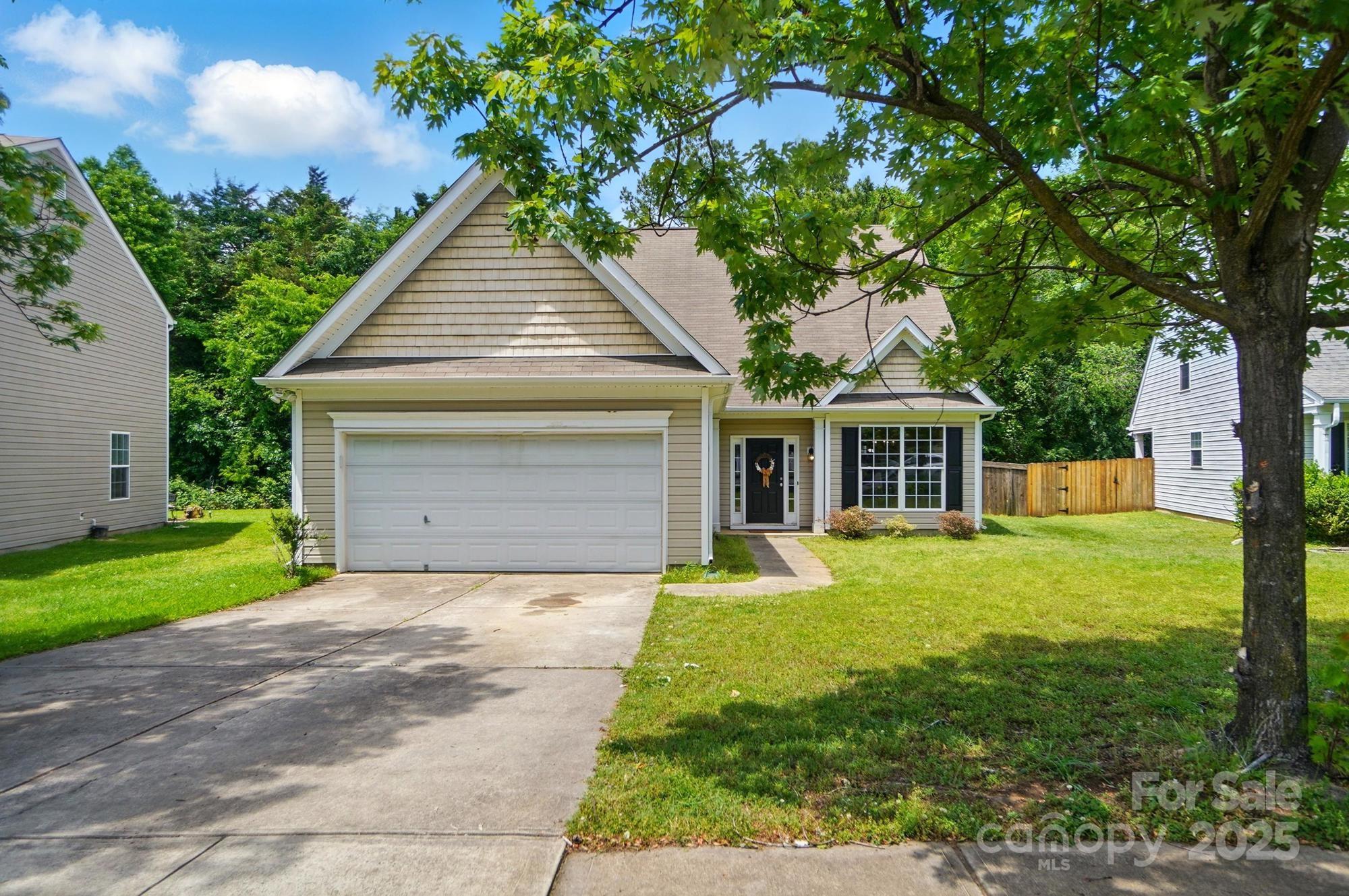 Welcome to this inviting home in Huntington Forest, nestled in the highly desirable Steele Creek area! This spacious 4-bedroom, 3-bath residence offers the perfect blend of comfort and convenience. The main floor features a kitchen with granite countertops, a dining room, and a great room with soaring vaulted ceilings. The primary suite boasts an en-suite bath, while a guest bedroom and full bath complete the main level. Upstairs, you'll find a generous loft, two additional bedrooms, and another full bath. Enjoy your private, fenced backyard that backs up to serene woods—ideal for relaxation or entertaining. The community offers an outdoor pool, playground, and expanding walking trails as part of the Steele Creek Greenway Plan. All this, just minutes from shopping, dining, the airport, major highways, outlets and more!