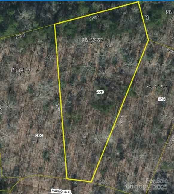 PRIME BUILDING LOTS! Approved for doublewides and modular homes in excellent Morganton location behind Food Lion, just off I-40 Exit 103. These wooded lots range from 0.5 to 2.4 acres with level, build-ready terrain. Select lots feature pre-approved 3-bedroom septic permits ( already pre perked buyer is responsible for getting septic permit on this lot) , with all parcels offering county water access and underground utilities. Road to be paved. Perfect opportunity for your new home in a convenient location with easy interstate access. These parcels offer the ideal blend of natural setting with nearby shopping and amenities. Choose your lot size to suit your needs - build now or hold for future development. Properties like these with utilities and approvals in place are increasingly rare! Call today to select your preferred parcel before they're gone. The  seller is allowing tree and brush buring on lot 9 and 10 to reduce clearing cost all listing agent on details
