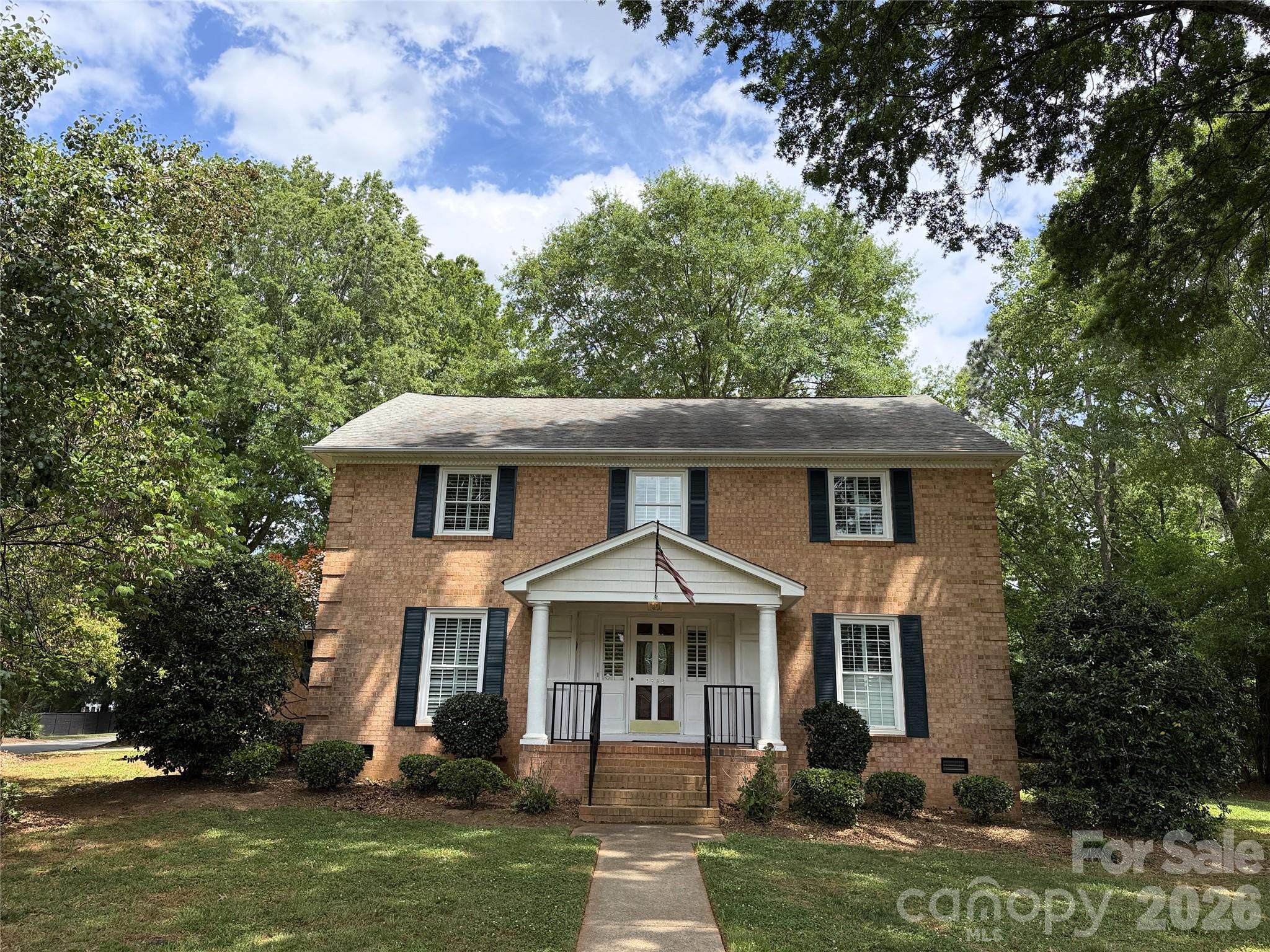 Located on a level 0.75± acre corner lot at the entrance of a quiet cul-de-sac, this classic three-story brick Colonial offers timeless appeal with mature oak trees and a desirable setting in an established neighborhood with no HOA. The property features a two-car garage and a functional, well-proportioned layout ideal for a variety of buyers.

The main level includes hardwood flooring throughout much of the living area, a comfortable family room with fireplace and gas logs, and a well-appointed kitchen with granite countertops and stainless steel appliances. Plantation shutters are installed on most windows throughout the home, providing both style and privacy.

Upstairs, the primary suite includes two walk-in closets and a fully updated en-suite bathroom featuring a glass shower and modern finishes. Additional bedrooms are well-sized and offer flexibility for family, guests, or home office use.

The third floor provides heated flex space currently without finished flooring, offering excellent potential to be completed as a bonus room, additional bedroom, or private retreat. The space features finished walls and is included in the home’s total heated square footage, presenting an opportunity for added value with minimal completion.

A pre-listing home inspection report and preliminary title commitment are available for review in the attachments section, providing helpful information for prospective buyers.