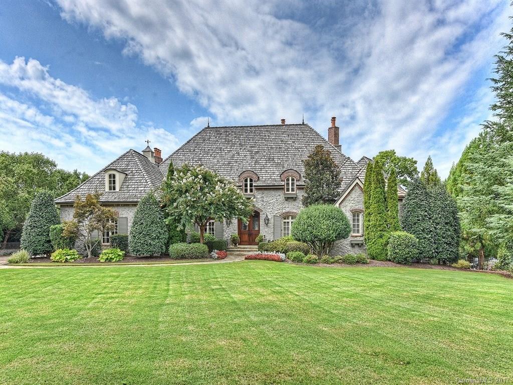 Oklahoma limestone home w/cedar shake roof. Wide open Lake Norman views. Exquisite Craftsmanship throughout. 7 fireplaces. Whole home auto & video, security cameras. 5 BR w/on suite bathrooms. Library w/FP. Chefs kitchen open to hearth room & breakfast. Grilling Porch with FP, owner's favorite! Lake level w/guest suite, rec, billiards, theater, bar, & exercise. Saltwater pool, spa, w/slide, waterfall, gas & wood fire pits, FP, outside shower. Private pier w/lift & 2 jet ski lifts.