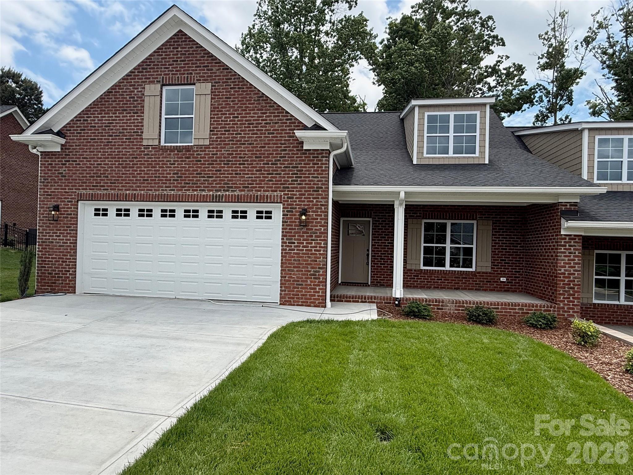 Don't miss one of the last two NEW CONSTRUCTION brick townhomes in the beautiful Magnolia Plantation! With 3 bedrooms, 2 baths, and an open floor plan, this home checks all of the boxes. A covered rocking chair front porch welcomes you into the large vaulted ceiling family room, dining area, and kitchen with breakfast bar. Beautiful finishes including quartz countertops, custom backsplash, stainless steel appliances, and high end cabinetry. Primary bedroom has tray ceiling and en-suite bathroom with dual vanities, spacious tile shower, and large walk-in closet. Second bedroom and additional hall bathroom on main level. Upstairs is a 3rd bedroom to be used as you wish! Large, partially covered Trex deck off the kitchen for great outdoor living. Also, there is a Rinnai tankless water heater for on demand hot water. Check out the completely finished garage - North Point Custom Builders overlooks no detail!  Great location close to Hwy 74 and Uptown Shelby!