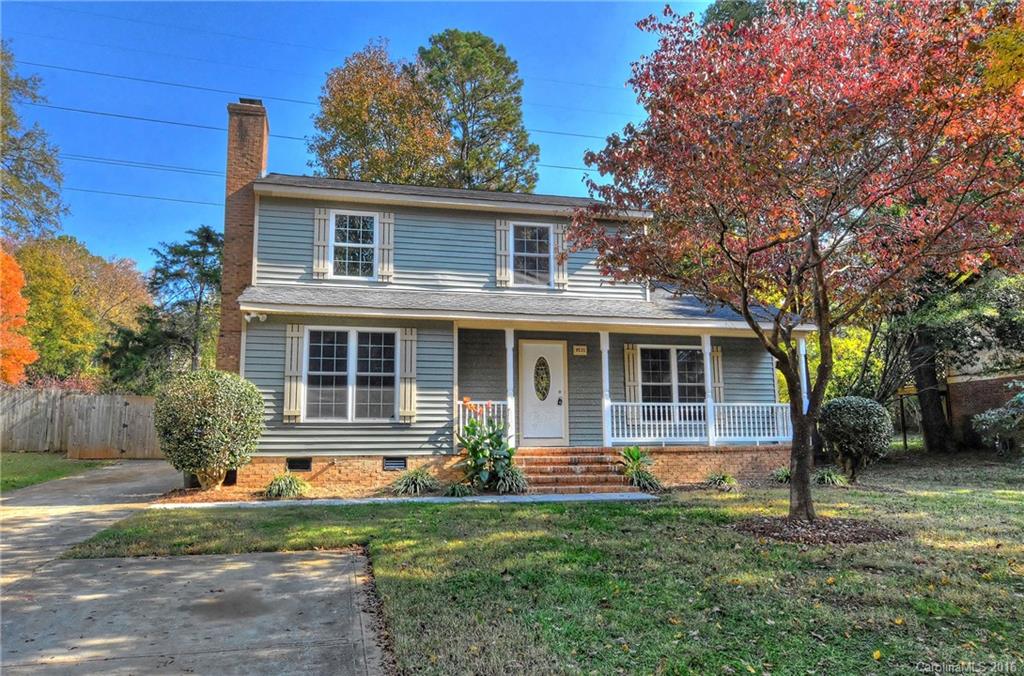 Nicely updated & move-in ready! Fresh paint, new carpet, wood laminate flooring, tiled foyer, kitchen, laundry & baths, updated lighting. Large living room open to DR. Den w/ masonry fireplace. Bright open kitchen w/ breakfast area. Master w/ custom crown molding & updated bath w/ tiled shower. HUGE covered deck overlooks awesome level privacy fenced yard w/ mature shade trees. Added parking & rocking chair front porch.