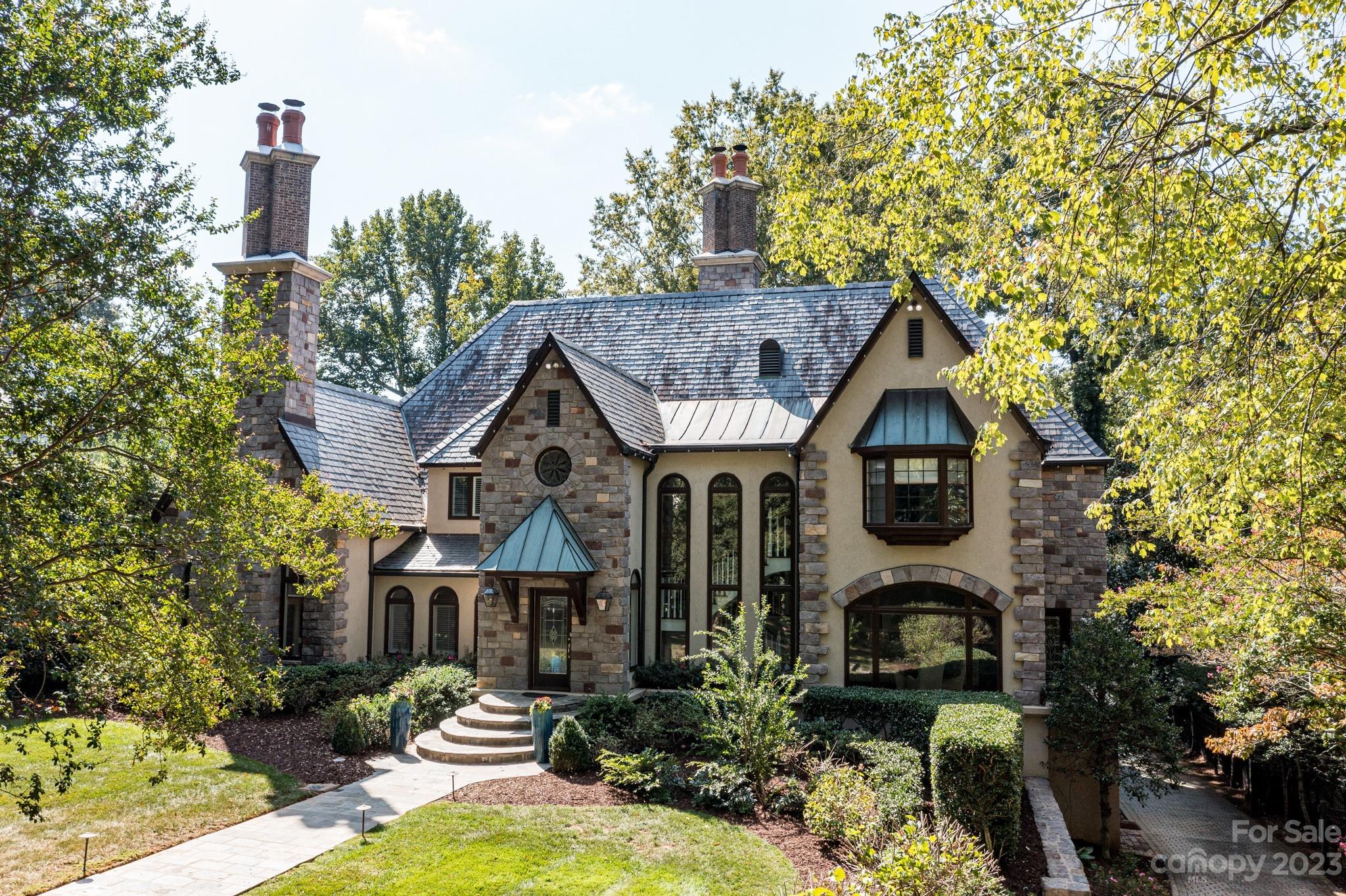 This beautiful custom home on the left hand side of the street on Lower Sherwood is known for having beautiful deep lots. At .66 acres in the heart of Myers Park, this property will not disappoint! High ceilings, substantial moldings and spacious formal areas add to the wow factor when you enter the home. The main level features an open layout that is very desirable to today's buyers. Large windows and French doors draw your eye to a large slate porch overlooking a beautiful back yard. This home features primary suites and laundry on both the main and upper levels of the home so you have the ability to choose for yourself. There are 3 secondary bedrooms on the upper level, each with private bathrooms. Centrally located in Myers Park you have easy walkability to neighborhood restaurants, boutique shopping, the greenway and nearby parks.
