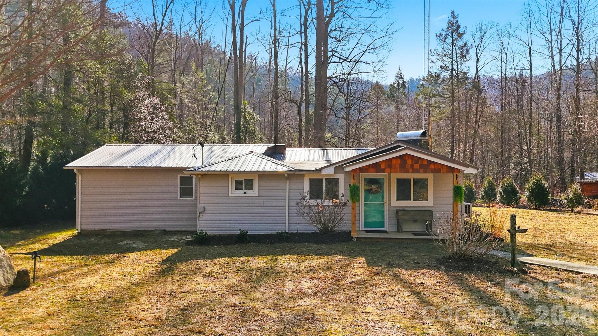 Tucked away near the scenic banks of Wilson Creek, this charming 2-bedroom, 2-bath home offers the perfect blend of comfort and mountain adventure. Located just minutes from the breathtaking trails and waterfalls of Pisgah National Forest, this property is a dream for outdoor enthusiasts and those seeking peaceful living surrounded by nature.
Inside, you’ll find a thoughtfully designed layout with  spacious bedrooms, two full bathrooms, and an inviting living area ideal for relaxing. Step outside to enjoy the fresh mountain air from your porch or deck — the perfect spot for morning coffee or evening unwinding. Whether you're looking for a full-time residence, weekend getaway, or investment opportunity, this home offers privacy, natural beauty, and convenient access to some of Western North Carolina’s most treasured outdoor destinations.  Experience mountain living at its best — where adventure meets tranquility.  Home is located in Flood Zone AE.