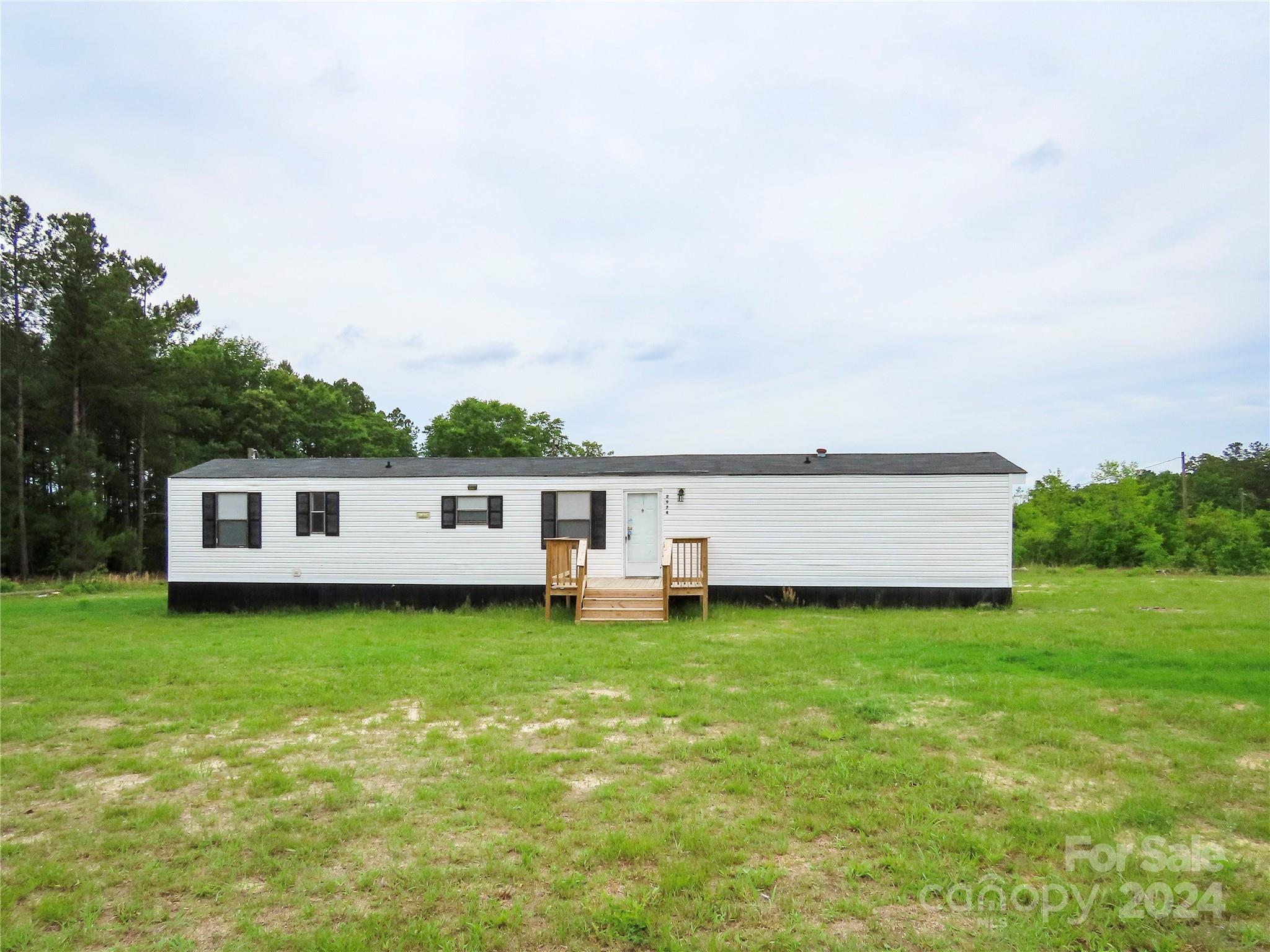If you are looking for country living, this is the home for you! Located in Bethune, SC just 22 min from Camden, SC.
Recently remodeled 1994  Horton Mirage 14 x 70 singlewide mobile home with 3 bedroom 2 bath and sits on 1 acre. Very nice! This home has been remodeled and updated with new floors in all of the rooms. The bathrooms have been updated, as well.  All appliances are included. This property has septic, and county water. The AC/Heating units are in good working order.