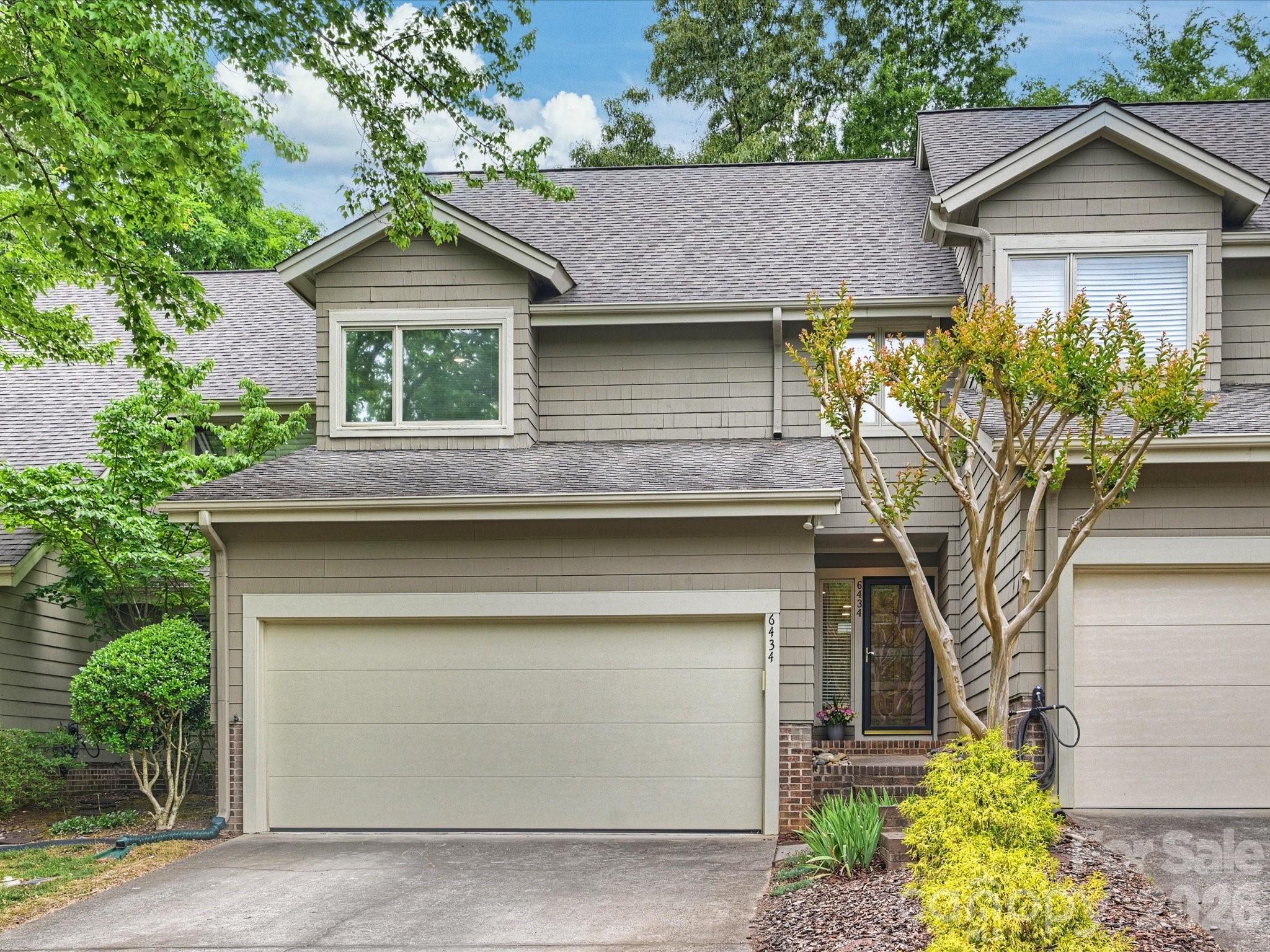 Welcome home to this move-in ready townhome in sought after Sharon View Place. This is one of the few townhomes in the community offering three bedrooms and a two-car attached garage. The living room features custom built-in cabinetry, a stone fireplace, large french style doors, vaulted ceiling and skylights, filling the space with abundant natural light. The living room and breakfast area both open to the back deck, creating an easy indoor-outdoor flow ideal for relaxing or entertaining. The bright kitchen offers stainless steel appliances, ample cabinetry and countertop space, providing excellent storage and functionality. Upstairs are three bedrooms, including the spacious primary bedroom with two large closets. This home also features a long list of thoughtful upgrades including LVP flooring added upstairs, newer carpet on stairs and living room, rocker dimmer switches added throughout the home and bulbless LED recessed lighting added to both levels. The garage contains both freestanding and ceiling industrial storage racks, maximizing organization and usable space. The HVAC and water heater were replaced in 2021. Ideally located just minutes from SouthPark and the Arboretum, and within walking distance to Olde Providence Racquet Club, this home offers exceptional convenience in a highly desirable location. This home is BACK ON THE MARKET at no fault of the sellers.