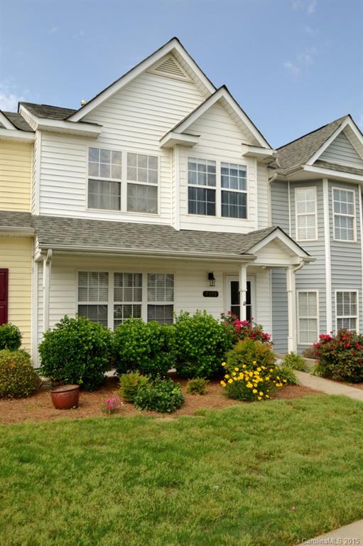 Welcome home to this spacious, open & bright townhome! The main floor features an oversized great room, functional kitchen with lots of counters/cabinets + island, dining room & walk-in laundry room! The second floor features the master suite with vaulted ceiling, dual vanity & walk-in closet as well as 2 addl bedrooms! The sellers have added tile floors & tile backsplash in kitchen & laminate in the great room/dining area!! Community pool! Amazing location minutes to Ballantyne, 485 & schools!