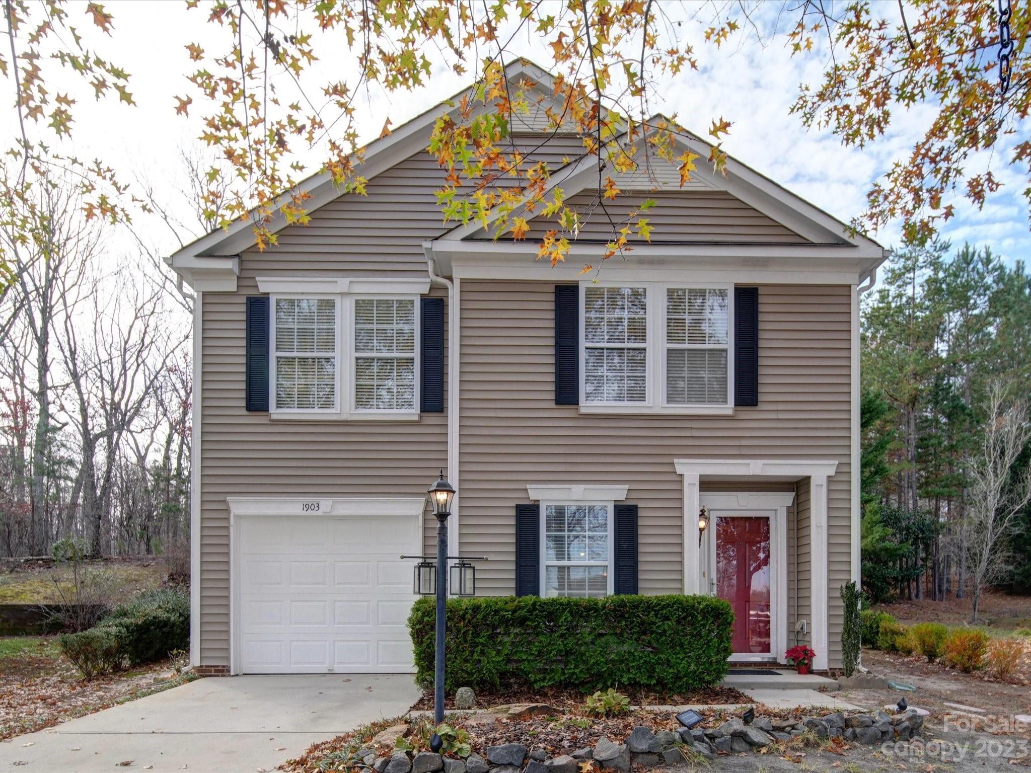 Welcome to this Harrison Park home which is a short commute to downtown Waxhaw where you will find boutiques, breweries, coffee shops, and dining! Situated in a cul-de-sac, this move-in-ready home has been freshly painted and features new flooring throughout. The spacious living room has a fireplace, leading to the dining room with sliding doors that open to the peaceful backyard, perfect for outdoor relaxation and entertaining. It offers three bedrooms upstairs, along with two full bathrooms and a bonus room. With its small low-maintenance lawn, this home promises easy upkeep while offering a wooded view in the backyard.