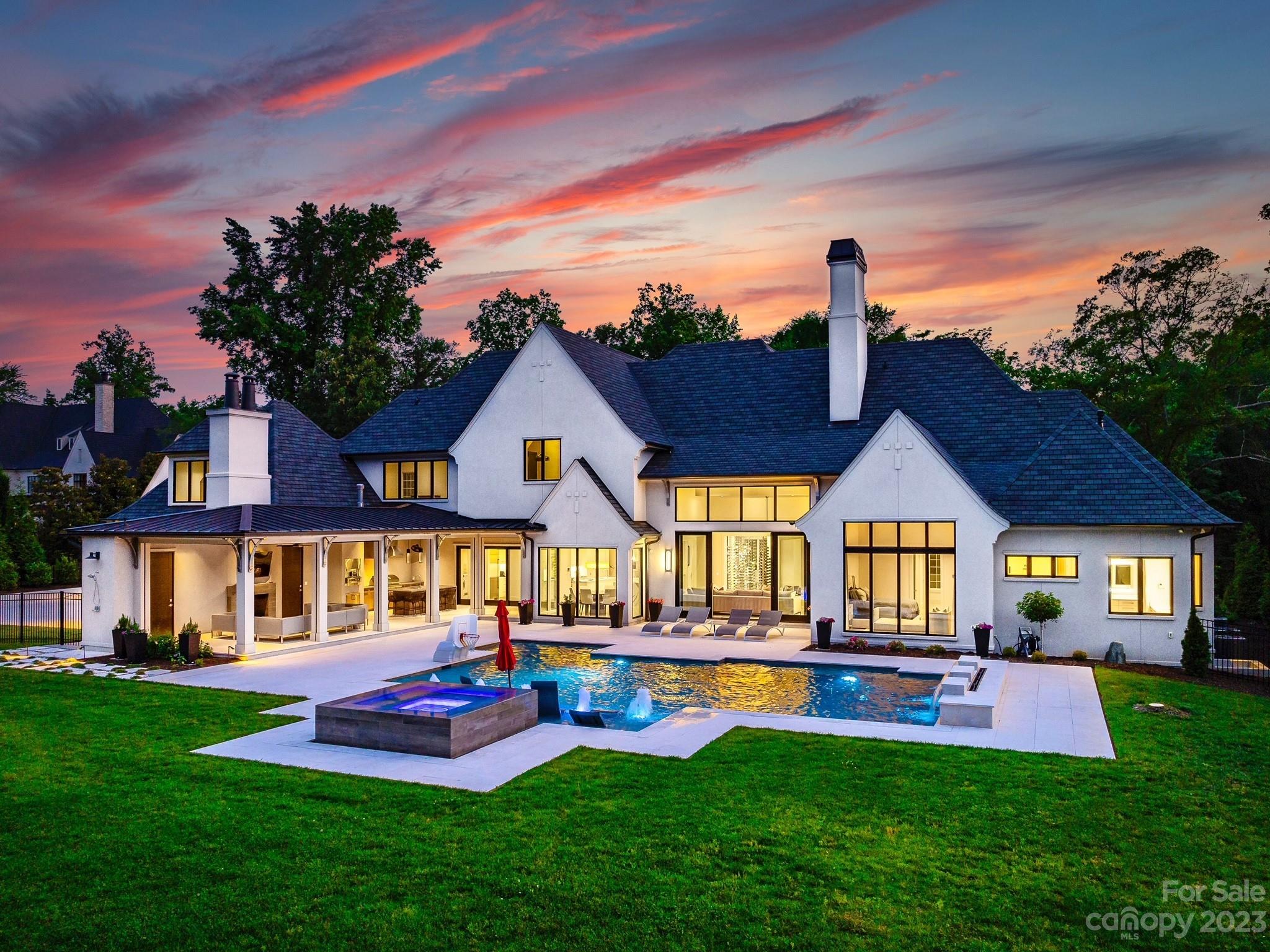 One of a kind, modern, Kingswood Home built in 2019. This exquisite home shows like a model home. Situated on 2-acres and with 7,491 square feet. The custom designed curved stairwell, by Artisan, and chandelier are breath taking. The main level and upper level feature a Walker Zanger light gray stone tile. The full glass refrigerated wined display room is like a work of art. Main level primary bedroom with custom designed, oversized closet and luxurious primary bathroom with heated floors and floating vanities. Main level features guest bedroom with ensuite and an office. The modern kitchen with double island and rift whit oak cabinetry, gourmet appliances, scullery room, all overlooking the gorgeous backyard and covered pavilion. Full wall of sliders, open up to the grilling pavilion with half bathroom and outdoor shower. Upper level features 3 guest bedrooms with ensuite, theater room, gym room and bonus room. Oversized pool and hot tub, with waterfall and fire wall. Impeccable home!