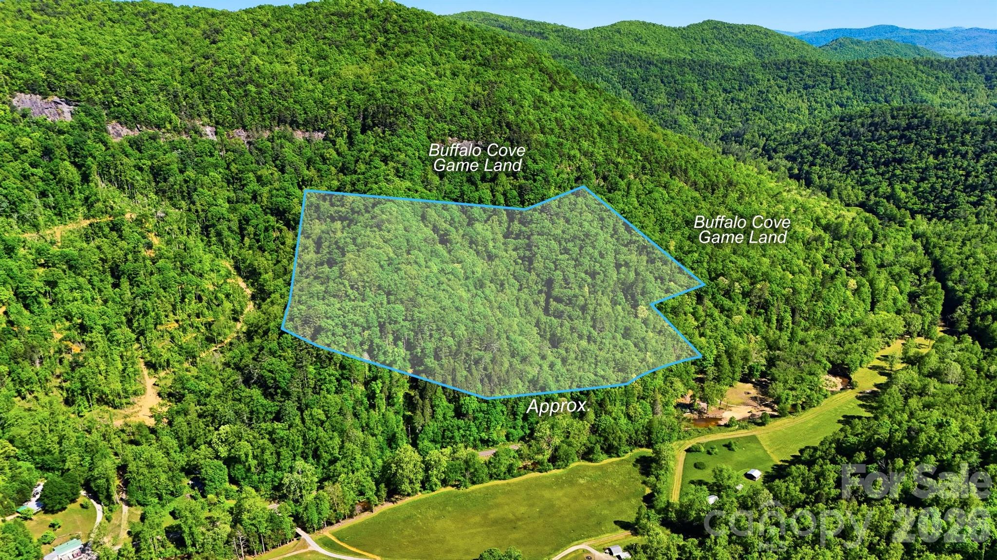 Rare 20.51-acre mountain tract on Buffalo Cove Road in Lenoir, offered as two adjoining parcels sold together. The property borders Buffalo Cove Game Land on both the east and south sides, putting thousands of acres of public hunting and outdoor recreation right at the back boundary. The land transitions from a gentle slope at the front — ideal for a homesite, cabin, or basecamp — into wooded mountainside that climbs to higher elevations, offering privacy, seclusion, and natural mountain beauty. Hardwood timber, varied terrain, and direct game land access make this a true hunter's and outdoorsman's paradise, equally suited for someone seeking a Western North Carolina getaway, family retreat, or recreational tract. Located directly across the road from the Buffalo Cove Community Center for an easy landmark reference. Caldwell County PINs 2855460710 and 2855366365 (Parcel IDs 14 2W35 4C and 14 2W35 4D). Sold as a package — will not be sold separately.