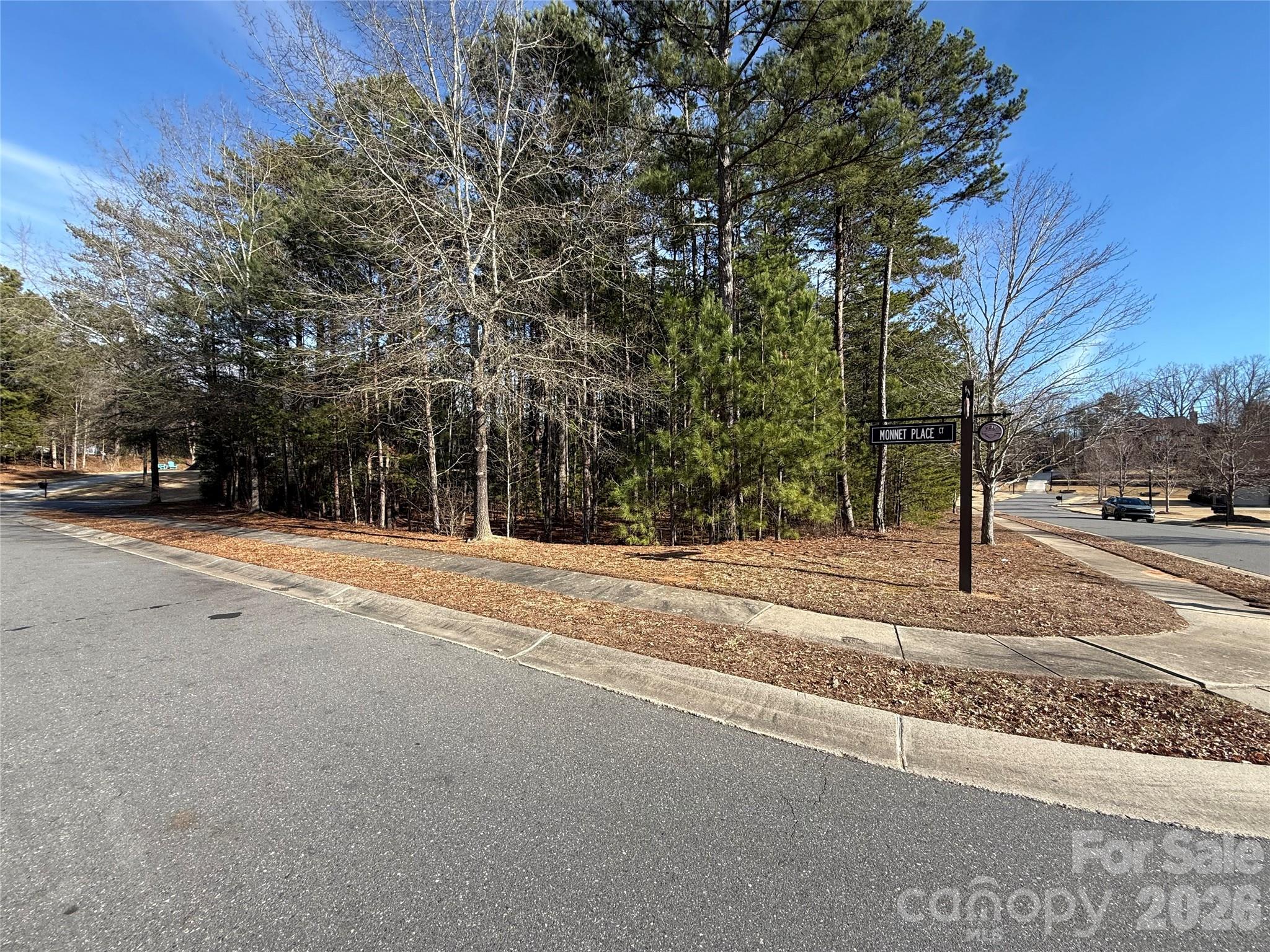 Prime corner lot in the sought-after Montreux neighborhood of the Palisades. This over half-acre homesite is ideally situated on a quiet, low-traffic street adjacent to a cul-de-sac with no through traffic, offering privacy and flexibility for your custom home design.

Enjoy a convenient location just minutes from McDowell Nature Preserve, Palisades Country Club, and Charlotte Douglas International Airport, with easy access to shopping, dining, and major roadways. This exceptional lot provides the perfect opportunity to build your dream home in a community known for natural beauty, recreation, and accessibility—ideal for living, working, and enjoying an active lifestyle.
