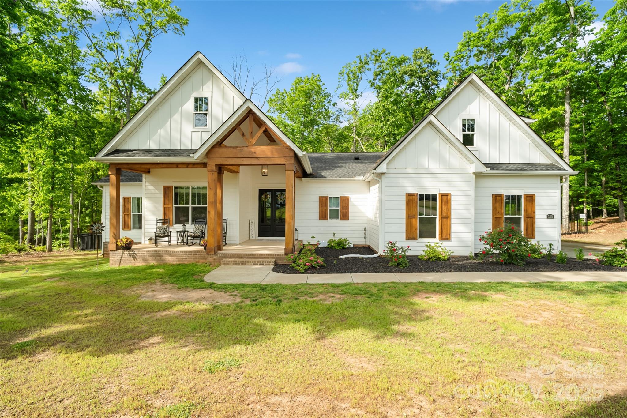 Welcome home to your dream retreat nestled in Clover! This beautifully maintained home, filled with natural light, is permitted for 4 bedrooms but could easily have 6. Over an acre of private, serene land offers the perfect blend of comfort, space, & Southern charm. Step inside to discover an inviting open-concept layout featuring a spacious living area, modern kitchen with quartz countertops, stainless appliances & ample cabinetry; ideal for entertaining or everyday living. The main level primary suite offers a peaceful escape with large walk-in closet & en-suite bath, complete w/ dual vanities & a soaking tub. Enjoy the outdoors from the covered porch or expansive backyard-perfect for gatherings, gardening, or simply unwinding in your private oasis. Plenty of room to add a pool! Award-winning Clover Schools & a short drive to Lake Wylie, shopping & dining; this home offers the ideal mix of rural tranquility & suburban convenience. Don't miss the opportunity to own this gem!
