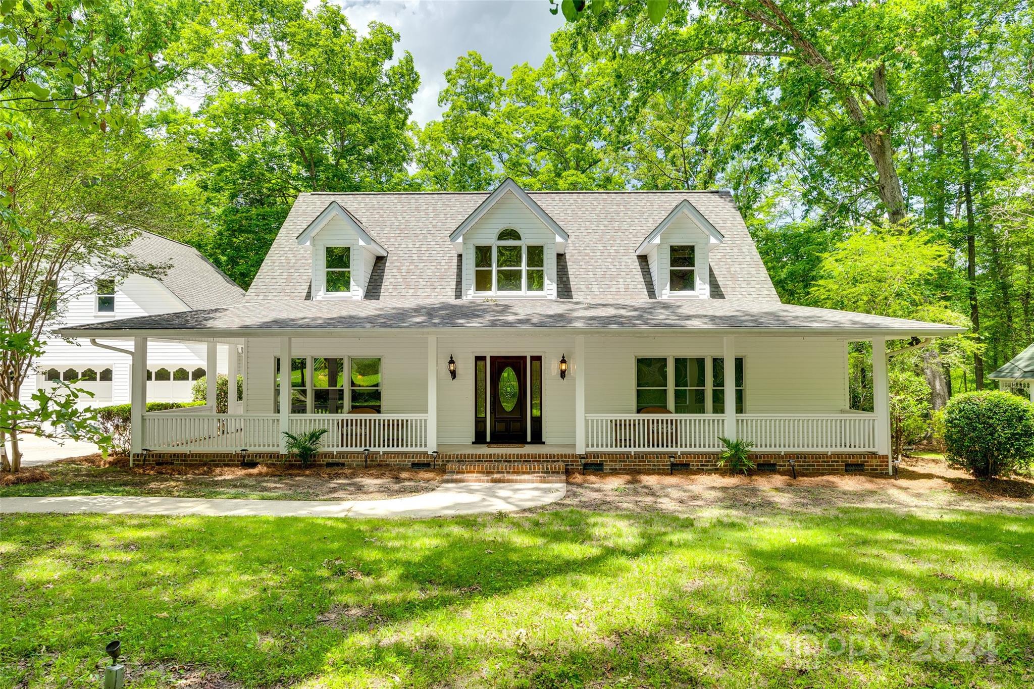 Private custom built home w/ a large pond on 8 acres of wooded land! Exquisite finishes throughout! As you enter you'll be greeted by the amazing pond views through the large windows in the Family Room, and also great views from the Dining and Sunroom. The Gourmet Kitchen offers Custom White Cabinetry w/ all the right options, Viking Range, Thermador built-in Fridge, trash compactor, ice maker, and many other high end features!  The Primary Bedroom located on the main level is spacious and has a custom closet and Primary Bathroom w/ Lovely features including a Standalone tub and beautiful cabinetry. Downstairs is an Office space w/ built-ins and also the Laundry Room full of cabinets and a folding area. Upstairs are 2 additional bedrooms and another full bathroom. There's also an additional Bonus Room above the Garage w/ storage. Plenty of outdoor living w/ a Covered Front Porch and then a back patio, Terrace, and Gazebo all overlooking the Large Pond in the back.