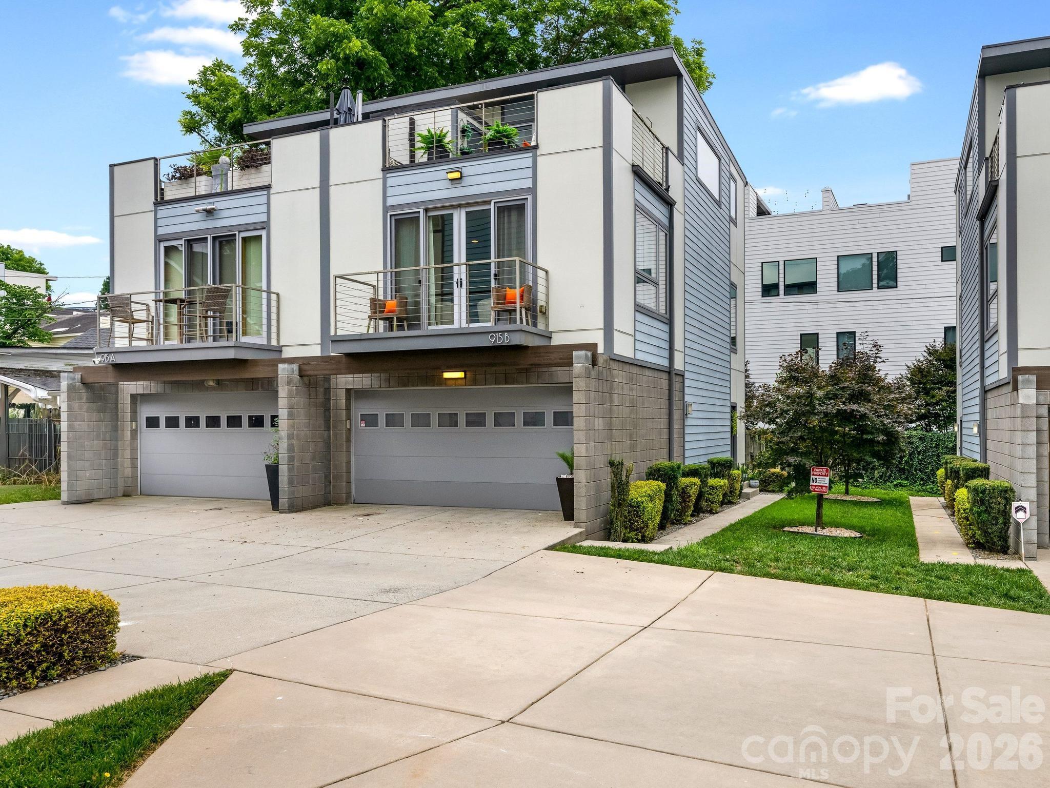 Elevated Uptown living in this beautifully updated 2-bedroom condominium, ideally located close to Bank of America Stadium, Truist Field, & Romare Bearden Park. Offering a blend of modern design, comfort, & convenience, this unit features fresh interior paint, newly refinished hardwood floors, and an open-concept floor plan filled with natural light. Spacious living level showcases a welcoming great room with upgraded designer lighting, gleaming hardwood floors, & access to a private balcony. Chef's kitchen is thoughtfully appointed with premium Café appliances, 6 burner gas ranch with convection oven, steam & air fry features, massive center island, tile backsplash, under-cabinet lighting, & a big pantry, making it perfect for both everyday living & entertaining. On the entry level, you'll find a private guest suite complete with Murphy bed, ensuite bath, generous walk-in closet, storage & access to the attached private two-car garage. Luxurious primary retreat occupies the entire upper level and features an ensuite bath with huge walk-in shower, double sinks, an expansive walk-in closet with custom shelving, & a private rooftop terrace with additional storage. Terrace is the perfect spot for morning coffee, evening cocktails, or grilling. Tons of living space & an unbeatable location minutes from some of Charlotte's hottest spots, entertainment, restaurants & 277. NO rental restrictions.