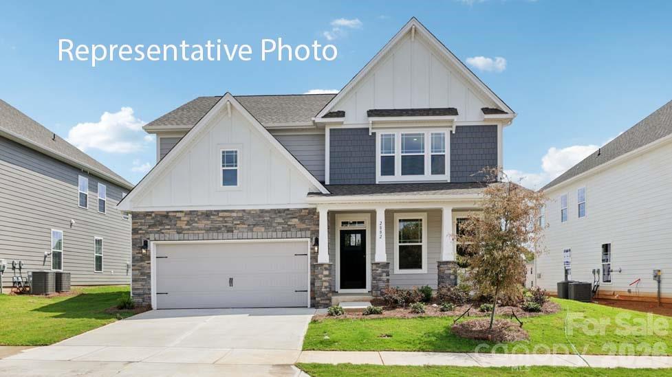 Hampshire plan offers formal dining room open to the butler's pantry and large walk-in pantry closet. The kitchen has an island that has pendant lights with Quartz countertop with subway backsplash. Chef's Kitchen includes gas whirlpool appliance package Stainless includes gas cook top, built in dishwasher, microwave and double wall ovens electric. Living room has a gas fireplace. Main flooring areas has extended Revwood flooring in main areas. First floor ceiling height 9ft with decorative molding two piece crown throughout first floor living area. Breakfast area looks out to the patio through the glass sliding doors. This home has a bedroom on the main level off the living room and steps away from the full bath down from the entry to the garage. The stairs are off the kitchen with open rails . Upstairs offers an open loft area off the primary suite with tray ceiling and sitting room with a spacious walk in closet.

Special Financing rates available with preferred lending!