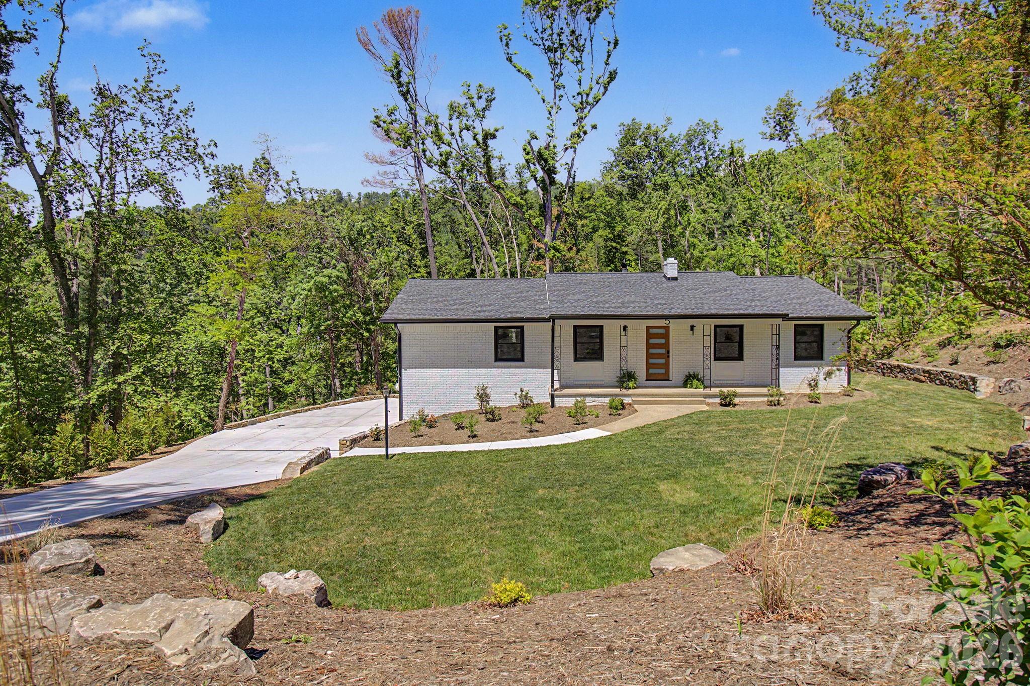 Welcome to 5 Kent Place!  Located in the highly sought after Beaverdam area of North Asheville.  Situated on one of the largest lots on Kent Pl. (1.22ac) on a cul de sac.  Recently renovated throughout, this 3bd/2ba is ready for you to call home. A list of all improvements that have been made are included in the attachments.  New windows, lighting accents and doors add to the fresh open floor plan feeling allowing for ample light.  Sit by the fireplace and enjoy the view into the backyard, or enjoy the view from the back deck. No HOA!!!