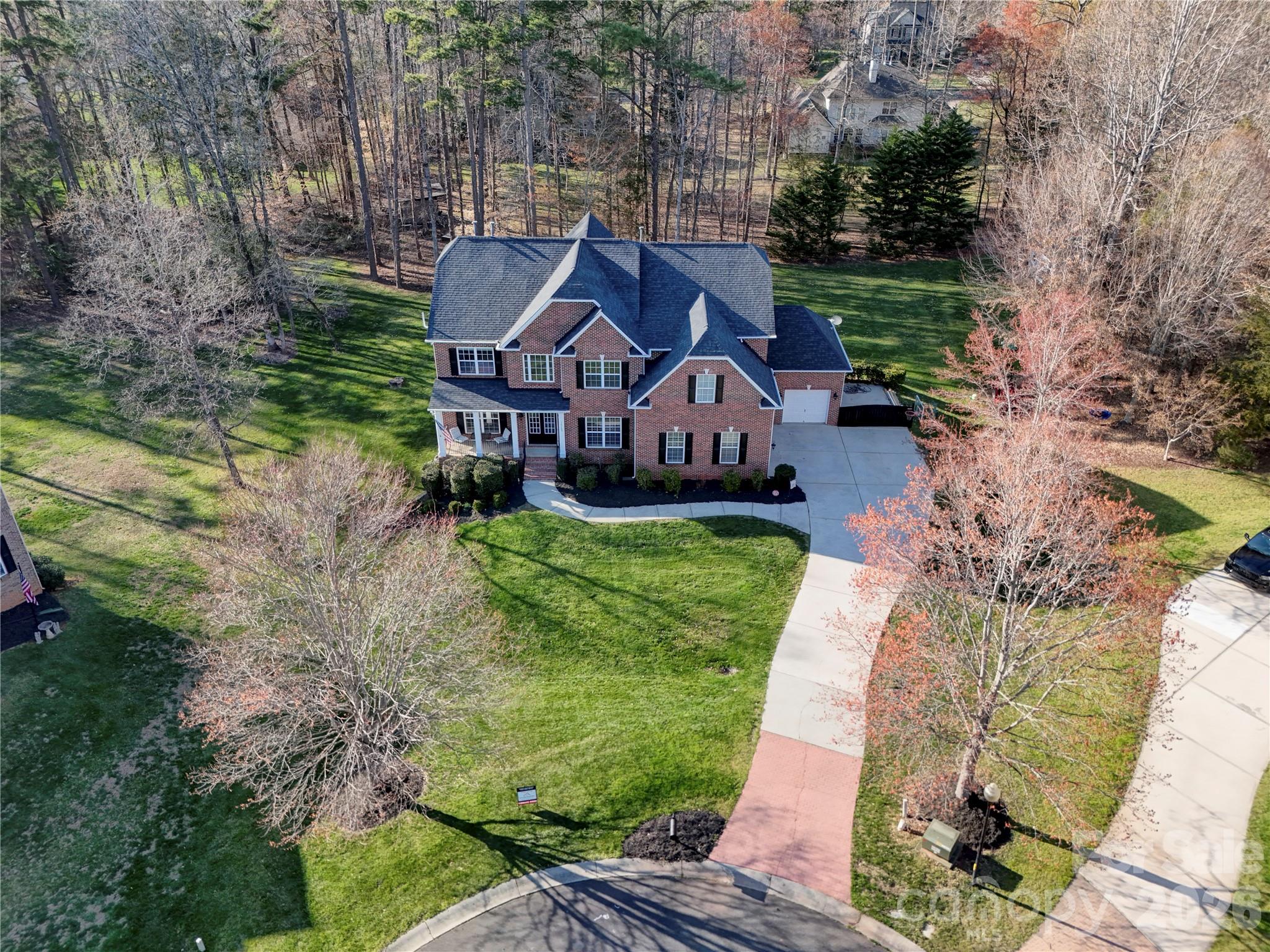 Welcome to 15100 Durmast Court in the desirable Fairington Oaks Community in Mint Hill- an exceptional full-brick estate nestled on a 0.80 acre cu-de-sac lot. Offering over 5,400 square feet of meticulously designed living space, this stunning 5-bedroom, 4.5 bath home delivers the perfect blend of elegance, comfort and versatility.
The main level features a beautifully updated kitchen with quality finishes, granite countertops, stainless steel appliances including a double oven,center island and more, ideal for both everyday living and entertaining. Gather in the inviting living area highlighted by a cozy fireplace with gas logs.On the main level you will also find a formal dining room, flex room, bathroom and laundry/mud room. On the upper level you'll find 3 generous sized bedrooms, including the oversized primary suite with ensuite full bathroom.There is also a very large bonus room/office space with endless possibilities.The fully finished basement is a standout feature, complete with private interior and exterior access-perfect for multi generational living or guest accommodations. This incredible lower level includes a full second kitchen with bar seating, spacious living area, private bedroom (ideal as a second primary suite), full bath, fitness room, wine cellar and a dedicated media room equipped with a large screen and comfortable seating for the ultimate movie night experience.

Outside you will be welcomed by a plush landscaped yard, a side load two car attached garage and a single attached garage, there is also a private patio in the back for family get togethers.Lower HOA fees while still enjoying the neighborhood pool and playground.

This home truly has it ALL-space,functionality and luxury-just minutes from shopping, dining, and top conveniences in Mint Hill.