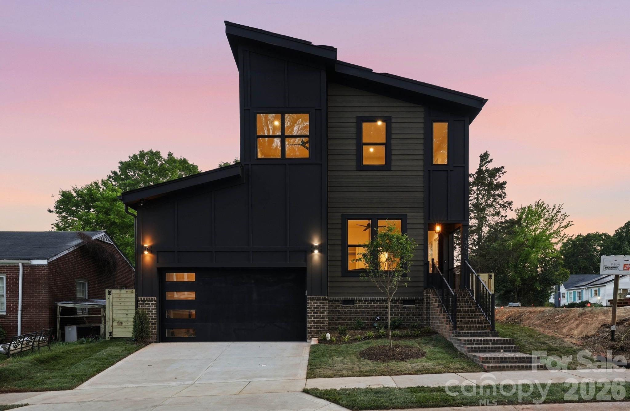 Located just minutes from Plaza Midwood and NoDa, this thoughtfully designed new construction property offers a rare opportunity to own a turnkey residence in one of Charlotte’s most vibrant areas. 

Blending elevated finishes with a highly livable layout, the main level begins with a versatile office or guest suite and a full bath, ideal for visitors or working from home. The space then opens into a bright, open-concept living area where the kitchen, dining, and living rooms flow seamlessly together. Large openings off the living room lead directly to a covered rear patio, creating an effortless connection to the outdoors and a spacious, fully fenced backyard designed for privacy, entertaining, and everyday enjoyment. The kitchen is a true focal point, featuring custom cabinetry, quartz surfaces, high-end appliances, a walk-in pantry, and a beautifully appointed wet bar. An oversized two-car garage with 14-foot ceilings adds both function and volume, with a well-appointed drop zone featuring custom built-ins and a pet feeding station creating a seamless transition into the home.

Upstairs, the primary suite serves as a private retreat with a spa-inspired bath and a custom walk-in closet. Three additional bedrooms offer flexibility for guests, family, or additional workspace, complemented by a well-appointed hall bath and a dedicated laundry room. Every detail reflects a focus on quality, from the hardwood floors and designer lighting to the seamless, built-in storage throughout.

Situated in the Plaza area, this home offers quick access to Plaza Midwood, NoDa, and Uptown Charlotte, with seamless connectivity to I-74 and other major roadways for easy commuting. Enjoy close proximity to the city’s top dining, retail, and everyday conveniences, along with access to highly regarded schools. This stunning residence represents a rare blend of new construction, elevated design, and one of Charlotte’s most dynamic and rapidly evolving locations.