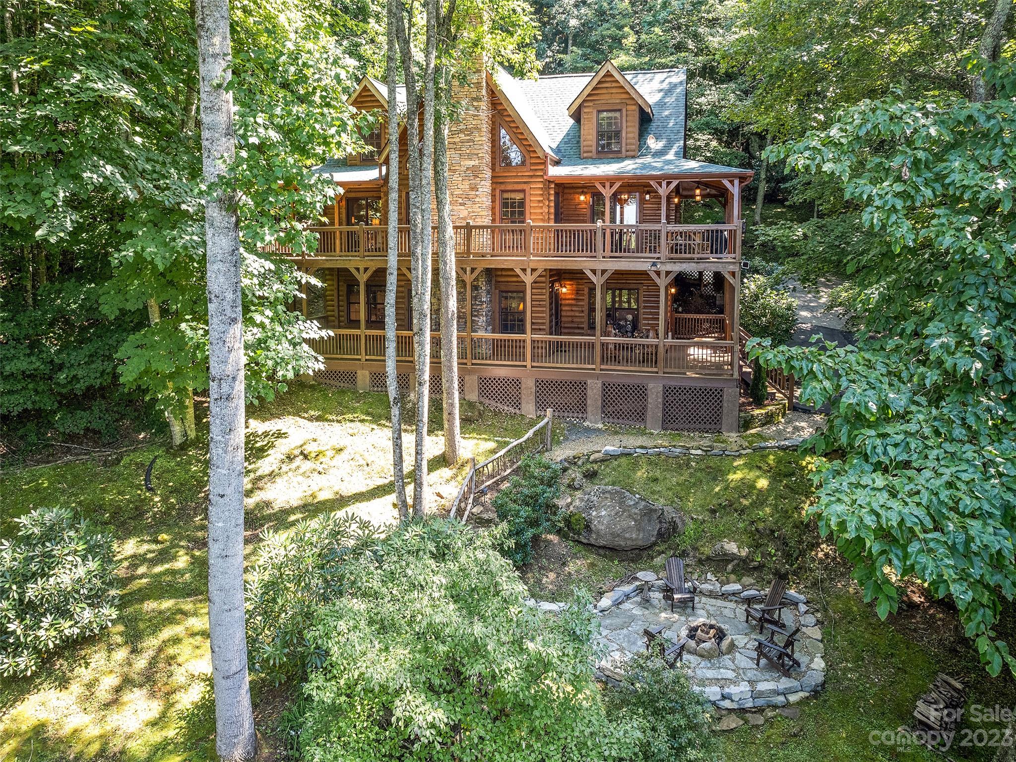 Charming Mountain Log Home with multi-level wrap around decks and mountain views. Located above 4,000 feet elevation to enjoy the cool summer weather. Front yard features a stream with a series of small waterfalls that flow into a lower pond. Expansive front yard with plenty of usable space for playing and entertaining. New roof and newly surfaced paved driveway. New built-in fire pit on stone patio with natural stone path. 3 Bedroom home with an additional room with a bed. Cozy Great Room with Stacked Stone gas fireplace, exposed beam, cathedral ceiling and wine bar; dining area off the kitchen with great views through the french doors to the upper deck. Primary bedroom with en suite bath, walk-in closet, and French doors to the upper deck; powder room, laundry and updated kitchen. Chef's kitchen with SS appliances, including Wolf duel range/oven, Bosch dishwasher,  breakfast bar w/leather stools. Furniture and accesories included with the exception of personal items to be listed.