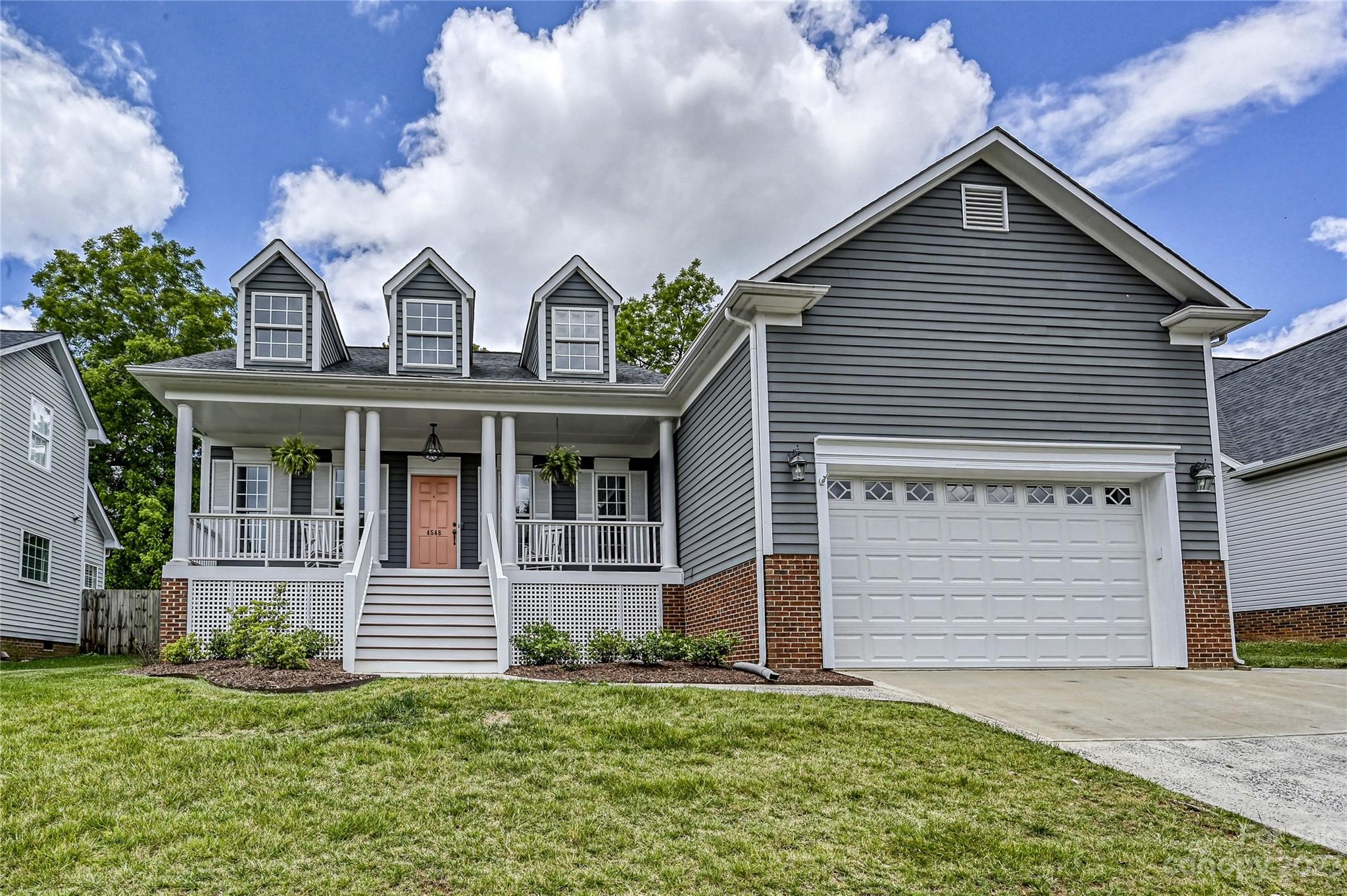 Don't miss this welcoming home with tons of curb appeal and a rocking chair front porch in the popular Cotswold neighborhood. This move in ready home has an open floor plan, high ceilings and brand new neutral paint! Beautiful hardwood floors in the main living areas and a bright white kitchen with stainless steel appliances, granite countertops and tile backsplash. Gorgeous stone fireplace with gas logs in great room and skylights which provide tons of natural light. Private fenced in backyard with deck, perfect for entertaining. Primary bath updated in 2020, furnace and HVAC replaced in 2015 and new hot water heater in 2022. Walkable to schools, dining, shopping, and neighborhood swim and tennis club. Conveniently located near SouthPark and Uptown. Welcome Home!